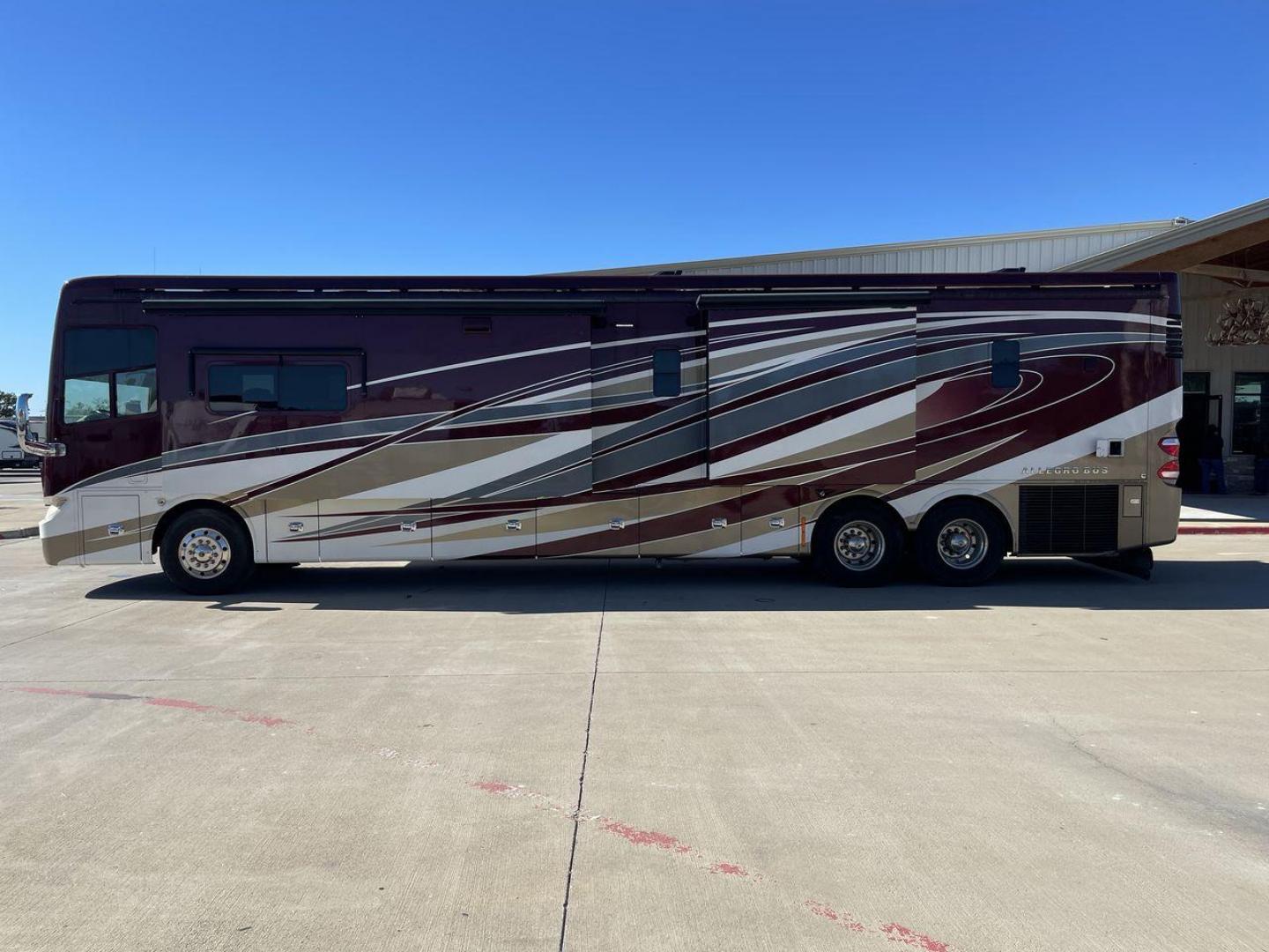 2017 TIFFIN ALLEGRO BUS 45OPP (5VBBAK7A6HA) , Length: 45 ft | Gross Weight: 51,000 lbs | Slides: 4 transmission, located at 4319 N Main Street, Cleburne, TX, 76033, (817) 221-0660, 32.435829, -97.384178 - The 2017 TIFFIN ALLEGRO BUS 45OPP features a luxurious exterior with a striking maroon, white, and beige paint scheme. The large, sleek side panels are accentuated by elegant, sweeping graphics, giving it an upscale, eye-catching look. The motorhome is built on a spacious chassis, with a prominent f - Photo#25