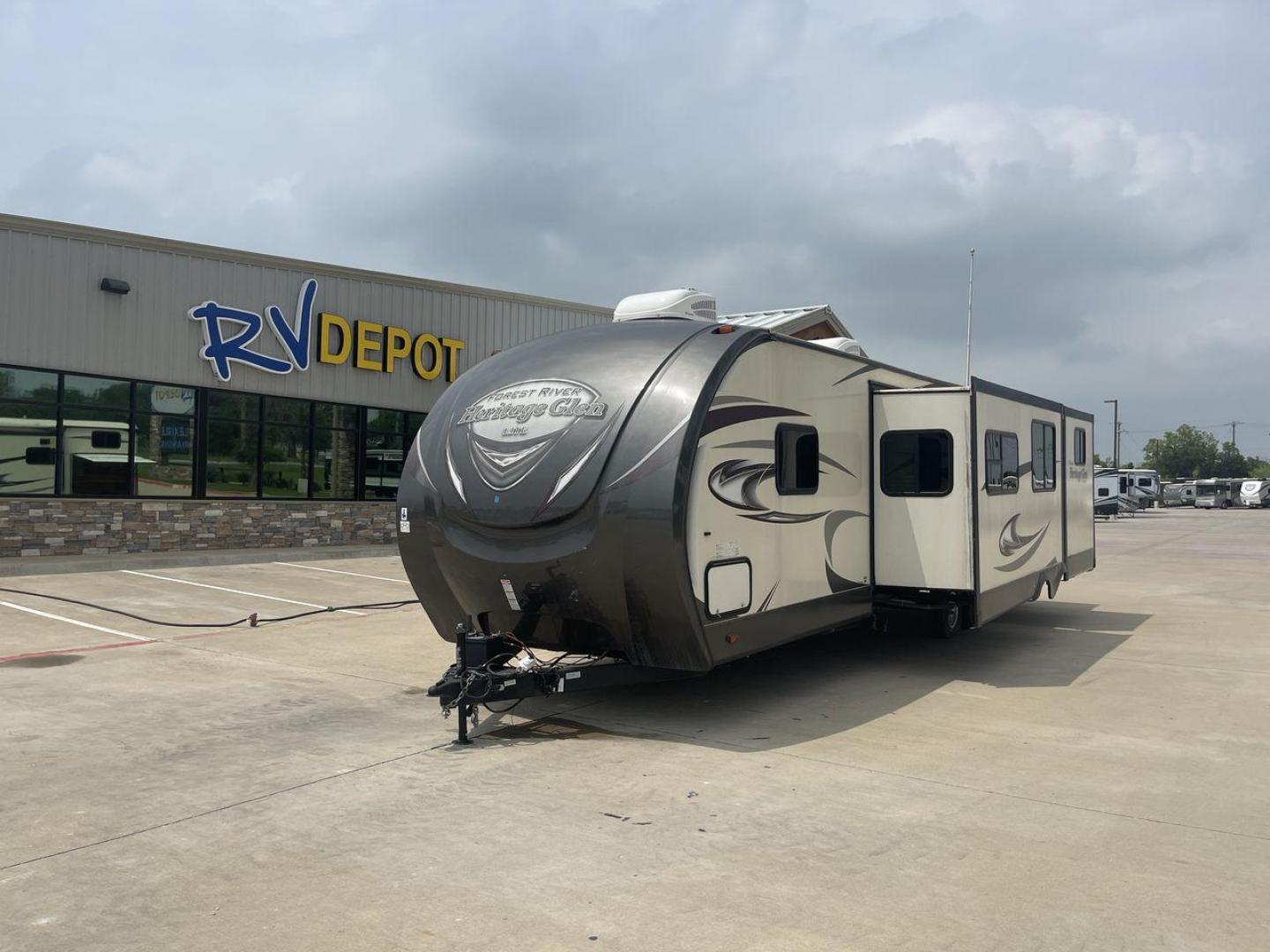 2017 TAN WILDWOOD HERITAGE GLEN 300BH (4X4TWBF29HU) , Length: 37.42 ft. | Dry Weight: 8,439 lbs. | Slides: 3 transmission, located at 4319 N Main Street, Cleburne, TX, 76033, (817) 221-0660, 32.435829, -97.384178 - The 2017 Wildwood Heritage Glen 300BH has roomy and comfortable rooms for your outdoor activities. This travel trailer offers ample space for the entire family, measuring 37.42 feet in length and weighing 8,439 pounds when dry. This trailer is designed with three slides, providing ample interior spa - Photo#0