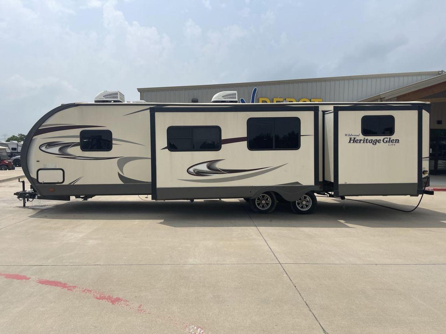 2017 TAN WILDWOOD HERITAGE GLEN 300BH (4X4TWBF29HU) , Length: 37.42 ft. | Dry Weight: 8,439 lbs. | Slides: 3 transmission, located at 4319 N Main Street, Cleburne, TX, 76033, (817) 221-0660, 32.435829, -97.384178 - The 2017 Wildwood Heritage Glen 300BH has roomy and comfortable rooms for your outdoor activities. This travel trailer offers ample space for the entire family, measuring 37.42 feet in length and weighing 8,439 pounds when dry. This trailer is designed with three slides, providing ample interior spa - Photo#24