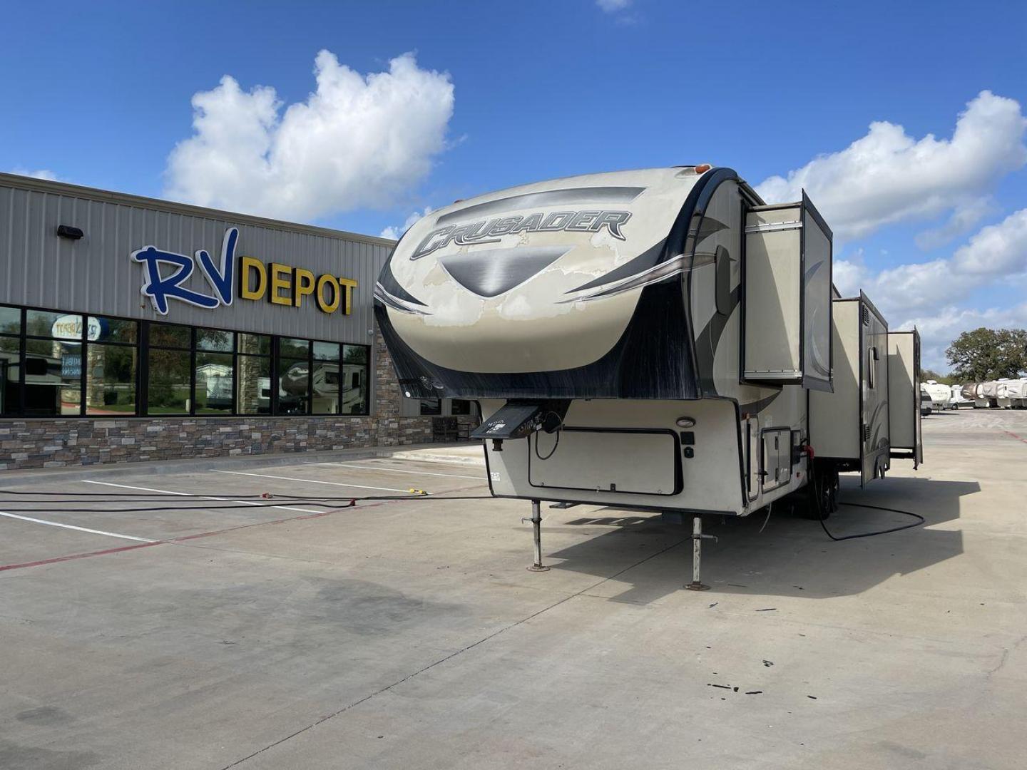 2018 TAN CRUSADER 3370BH (5ZT3CSZB7JG) , Length: 37.75 ft | Dry Weight: 10,661 lbs. | Slides: 4 transmission, located at 4319 N Main Street, Cleburne, TX, 76033, (817) 221-0660, 32.435829, -97.384178 - The 2018 Crusader 3370BH is a remarkable fifth wheel that redefines luxury and functionality, measuring 37.75 feet in length and featuring four expansive slideouts. This model is designed to maximize living space and comfort on the road, offering an exceptional travel experience. One of its standout - Photo#0