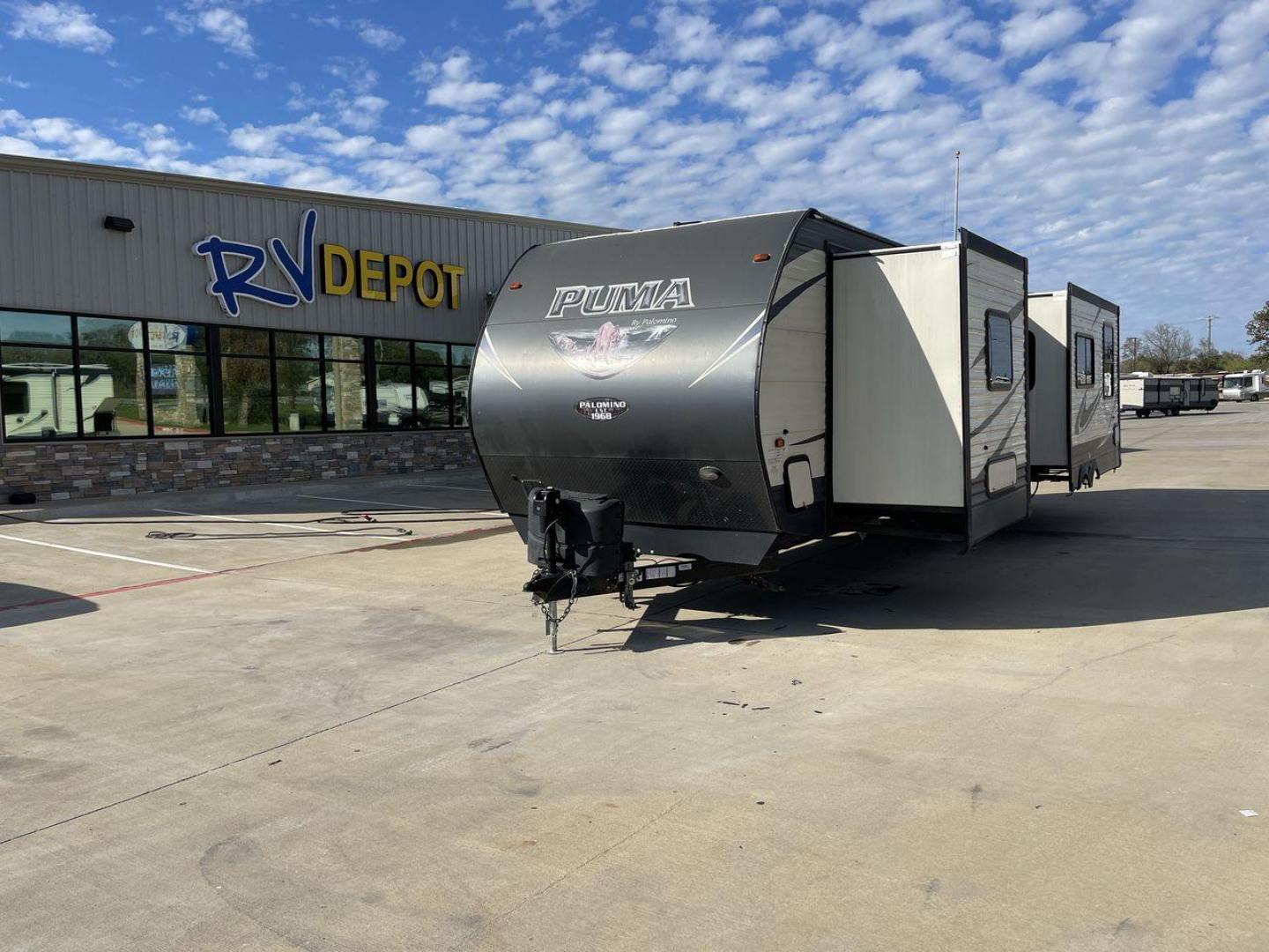 2018 TAN FOREST RIVER PUMA RKTS - (4X4TPUH21JP) , Length: 35.58 ft. | Dry Weight: 7,941 lbs | Gross Weight: 9,600 lbs | Slides: 2 transmission, located at 4319 N Main Street, Cleburne, TX, 76033, (817) 221-0660, 32.435829, -97.384178 - The 2018 Forest River Puma 32RKTS is designed for comfort and convenience. This travel trailer promises a home-away-from-home experience that will redefine your journey. It features a unique rear kitchen layout, providing an expansive and well-equipped culinary space. With ample counter space, a thr - Photo#0