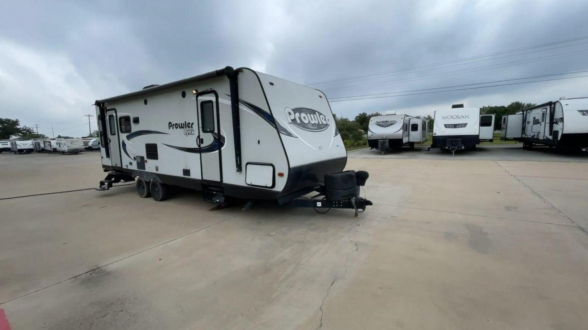 2018 WHITE HEARTLAND PROWLER 255LX (5SFPB2928JE) , Length: 29.5 ft. | Dry Weight: 6,158 lbs. | Gross Weight: 7,600 lbs. | Slides: 1 transmission, located at 4319 N Main Street, Cleburne, TX, 76033, (817) 221-0660, 32.435829, -97.384178 - The 2018 Heartland Prowler 255LX is a single-slide travel trailer measuring 29.5 ft. It has a dry weight of 6,158 lbs. and a GVWR of 7,600 lbs. This cute and comfy trailer can sleep up to 6 people! Inside, you will find a spacious combined living and kitchen area with a kitchen island with a built-i - Photo#3