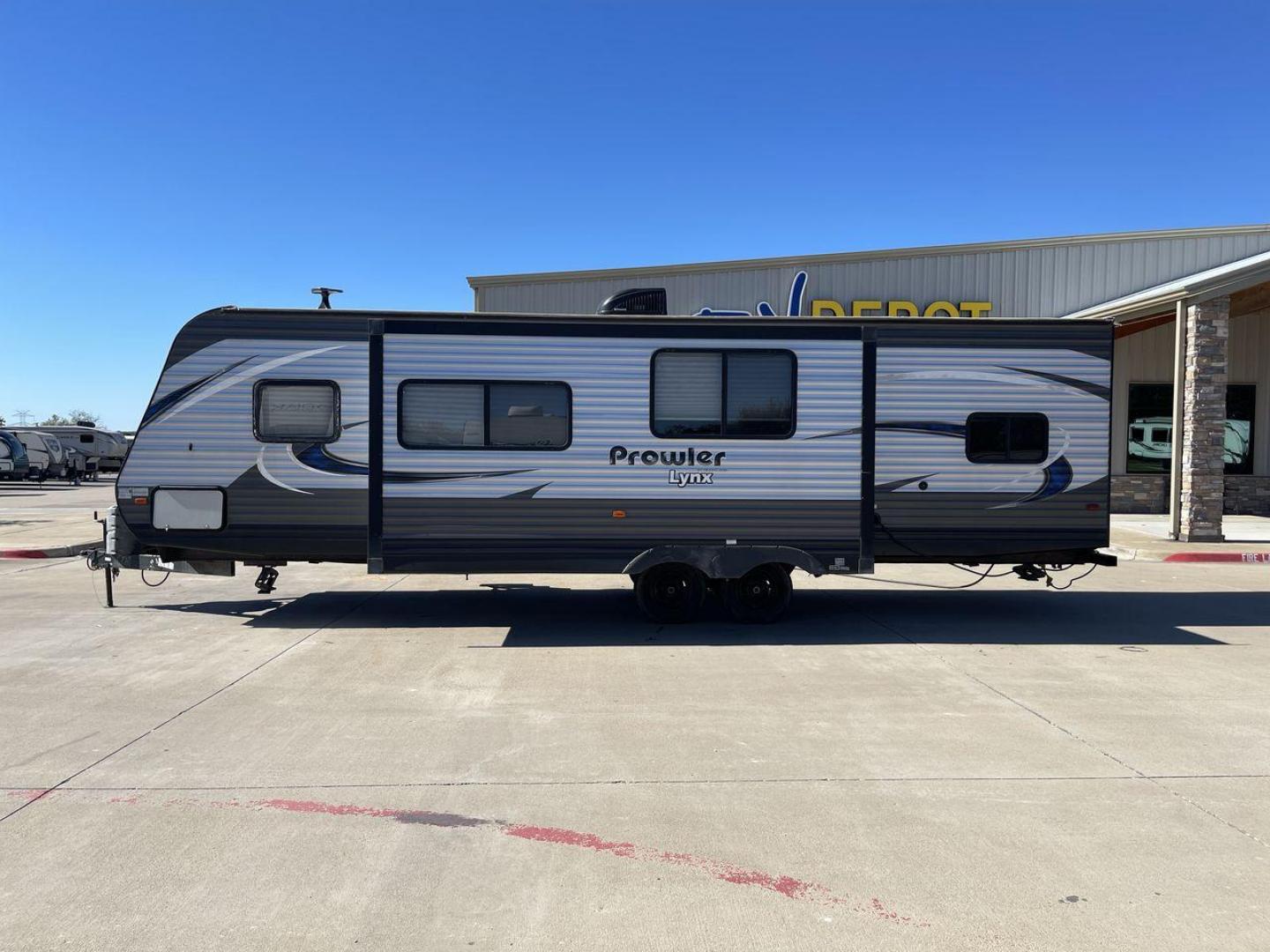 2018 HEARTLAND PROWLER (5SFPB3326JE) , Length: 33.92 ft. | Dry Weight: 6,720 lbs. | Gross Weight: 9,000 lbs. | Slides: 1 transmission, located at 4319 N Main Street, Cleburne, TX, 76033, (817) 221-0660, 32.435829, -97.384178 - This 2018 Prowler 30LX travel trailer measures 33'11" feet. It is a dual axle, steel wheel setup with electric drum brakes. Its dry weight is 6,720 lbs, its payload capacity 2,130 lbs, its hitch weight 880 lbs, and the GVWR 9,000 lbs. The fiberglass exterior is painted gray with blue and white graph - Photo#22