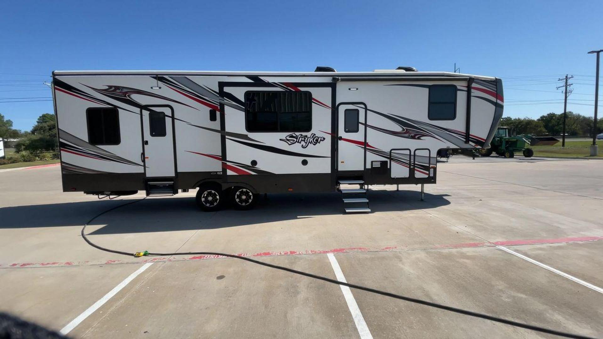 2018 HEARTLAND STRYKER 3513 (5RXGG3929J2) , Length: 39.08 ft. | Dry Weight: 13,116 lbs. | Gross Weight: 17,000 lbs. | Slides: 3 transmission, located at 4319 N Main Street, Cleburne, TX, 76033, (817) 221-0660, 32.435829, -97.384178 - Photo#2