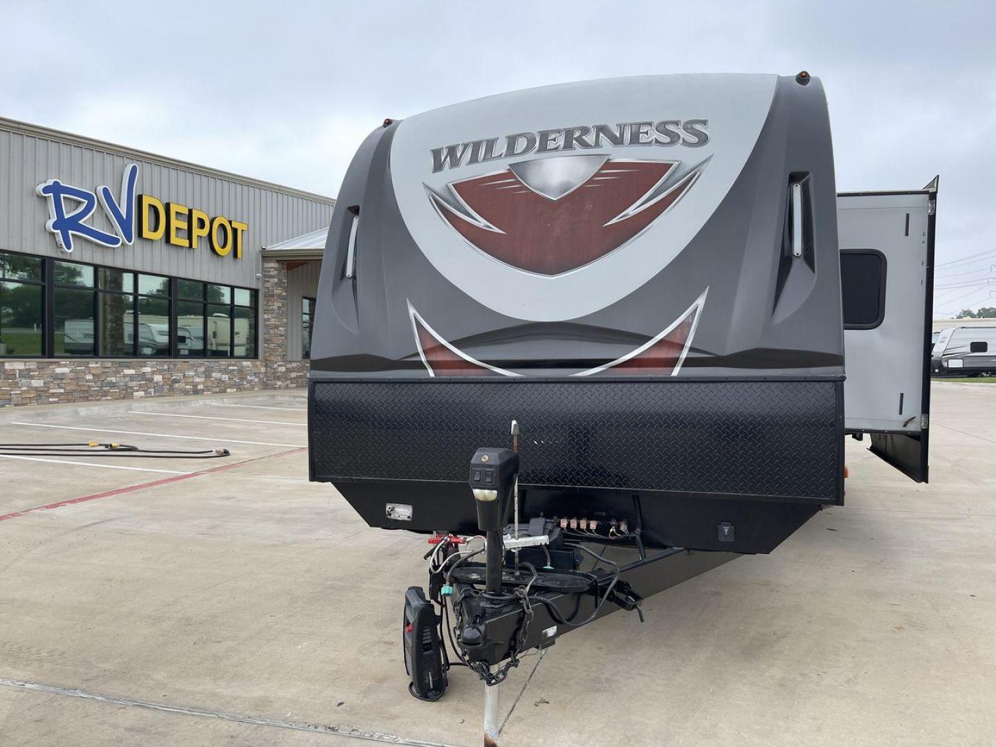 2018 GRAY HEARTLAND WILDERNESS 3250BS - (5SFNB3229JE) , Length: 36.75 ft. | Dry Weight: 7,680 lbs. | Gross Weight: 8,600 lbs. | Slides: 3 transmission, located at 4319 N Main Street, Cleburne, TX, 76033, (817) 221-0660, 32.435829, -97.384178 - The 2018 Wilderness 3250BS Travel Trailer is the true definition of both luxury and functionality. It is guaranteed to transform your travel experience into a journey of comfort and convenience. Measuring 36 feet in length, this travel trailer offers a spacious and well-designed interior to accommod - Photo#0