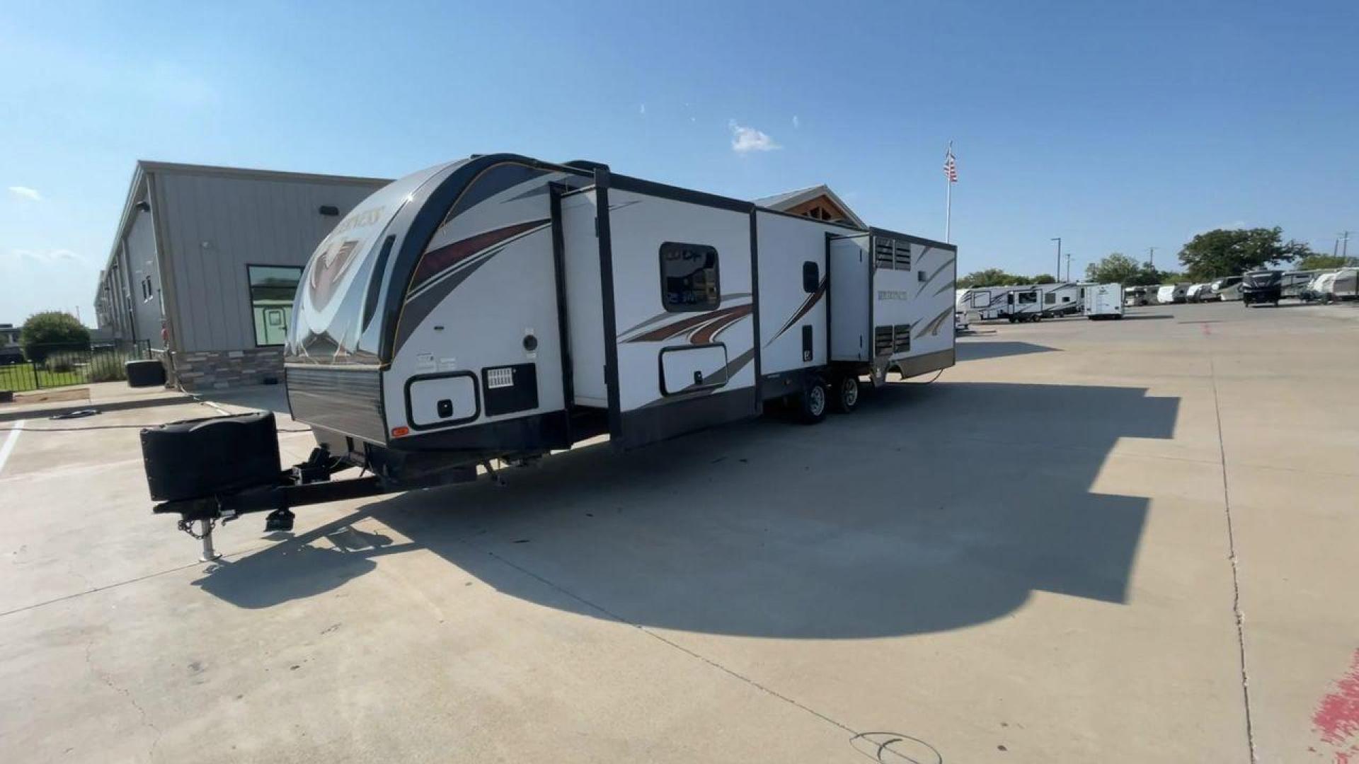 2018 GRAY HEARTLAND WILDERNESS 3375KL (5SFNB3926JE) , Length: 39.67 ft. | Dry Weight: 8,699 lbs. | Gross Weight: 9,600 lbs. | Slides: 3 transmission, located at 4319 N Main Street, Cleburne, TX, 76033, (817) 221-0660, 32.435829, -97.384178 - If you're searching for a travel trailer that offers the true comforts of a regular home, this 2018 Heartland Wilderness 3375KL is the one for you! It measures just a bit under 40 ft. in length and weighs 8,699 lbs. unloaded. It has a GVWR of 9,600 lbs. and a hitch weight of 799 lbs. It is sizable y - Photo#5