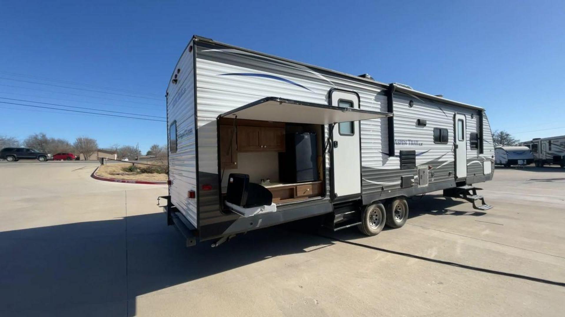 2018 KEYSTONE ASPEN TRAIL 31BH (4YDT31B2XJ8) , Length: 35.83 ft. | Dry Weight: 7,060 lbs. | Slides: 2 transmission, located at 4319 N Main Street, Cleburne, TX, 76033, (817) 221-0660, 32.435829, -97.384178 - This 2018 Keystone Aspen Trail 31BH is a dual-axle steel wheel setup measuring 35.83 ft. in length and 11.25 ft. in height. It has a dry weight of 7,060 lbs. and a payload capacity of 2,620 lbs. It includes two power slides as well as one power awning. This travel trailer is a bunk model that can - Photo#1