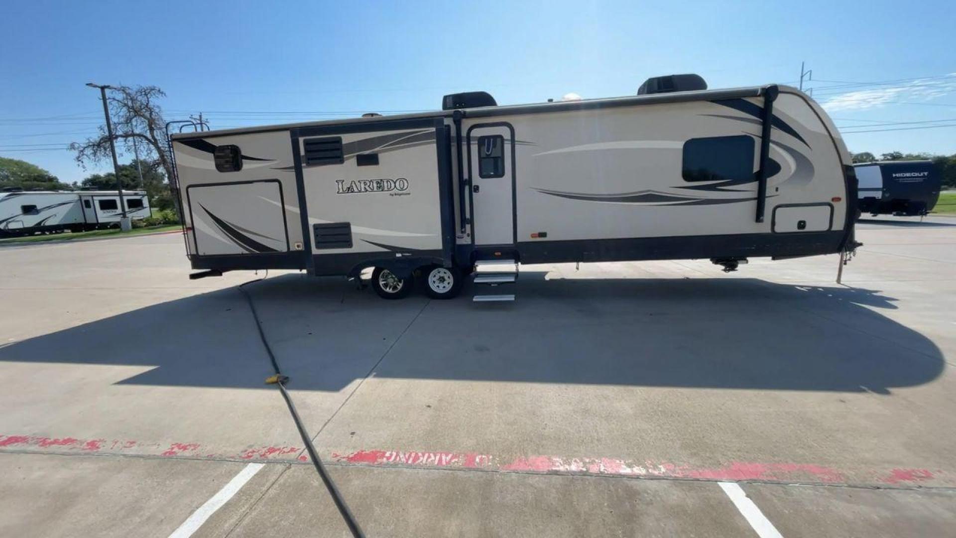 2018 KEYSTONE LAREDO 331BH (4YDT33129JV) , Length: 37.92 ft. | Dry Weight: 8,090 lbs. | Gross Weight: 9,655 lbs. 9,655 lbs. | Slides: 3 transmission, located at 4319 N Main Street, Cleburne, TX, 76033, (817) 221-0660, 32.435829, -97.384178 - Photo#2