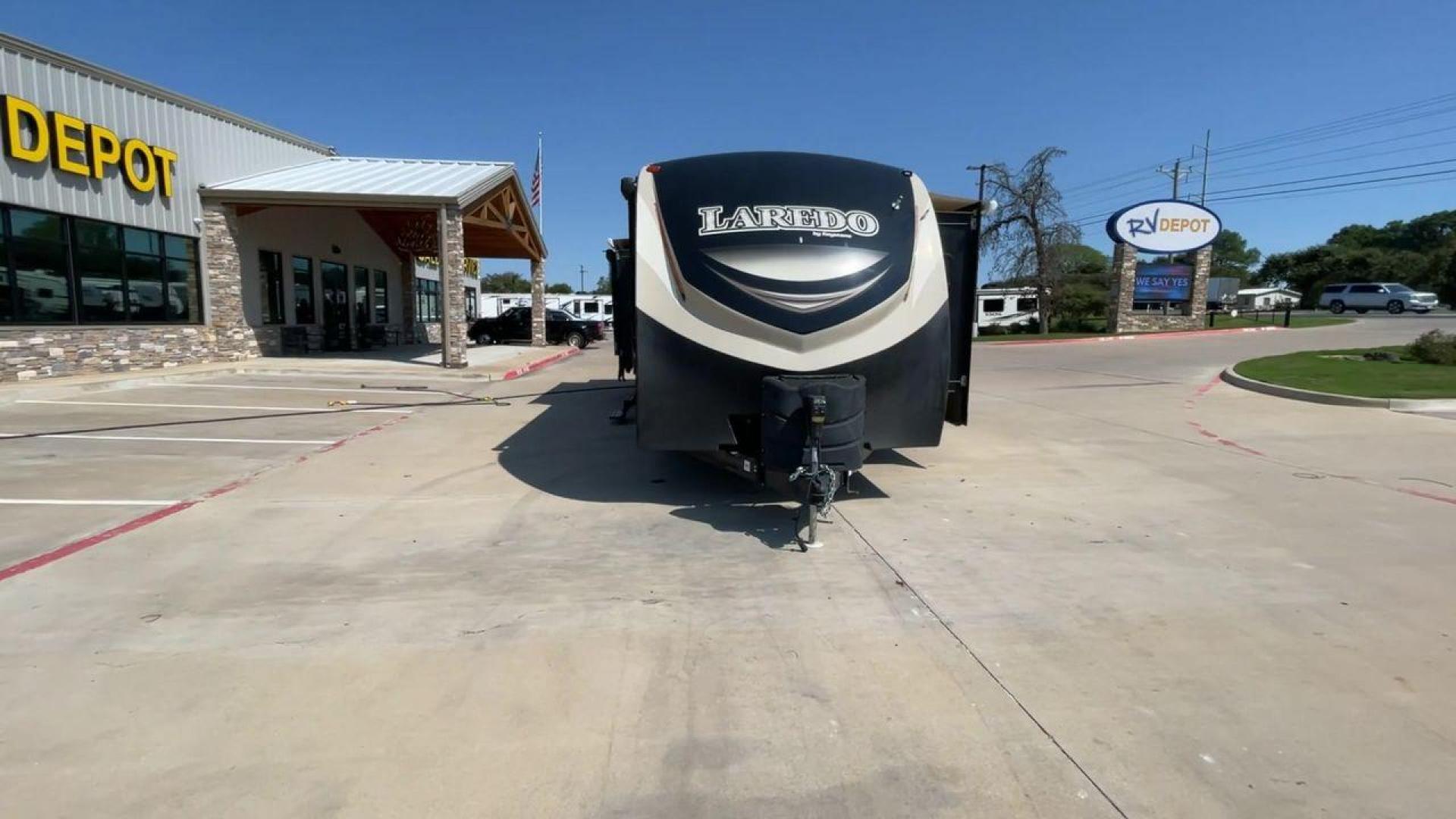 2018 KEYSTONE LAREDO 335MK (4YDT33524JV) , Length: 37.92 ft. | Dry Weight: 8,473 lbs. | Gross Weight: 10,000 lbs. | Slides: 2 transmission, located at 4319 N Main Street, Cleburne, TX, 76033, (817) 221-0660, 32.435829, -97.384178 - The 2018 Keystone Laredo 335MK is a spacious and feature-packed travel trailer with a length of 37.92 ft, a dry weight of 8,473 lbs, and a gross weight capacity of 10,000 lbs. It includes two large slide-outs, significantly expanding the living and kitchen areas. The exterior features a cream and be - Photo#4