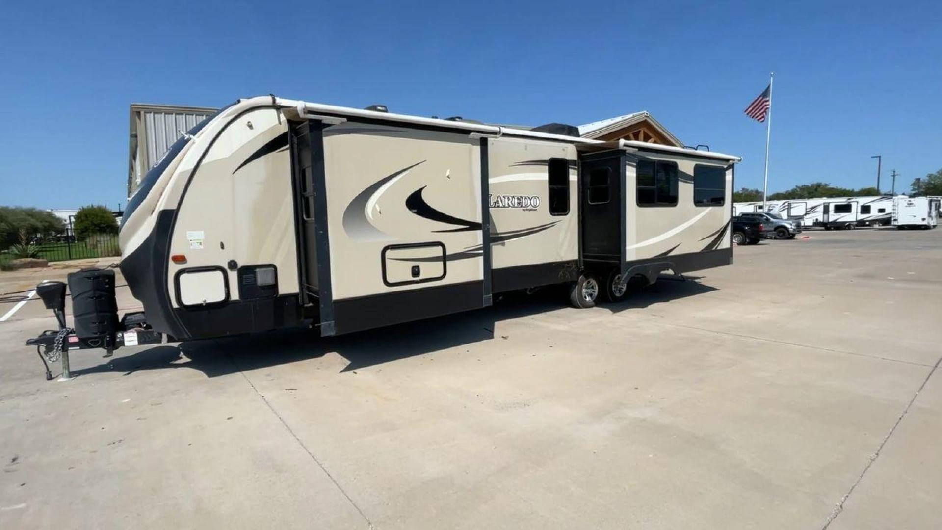 2018 KEYSTONE LAREDO 335MK (4YDT33524JV) , Length: 37.92 ft. | Dry Weight: 8,473 lbs. | Gross Weight: 10,000 lbs. | Slides: 2 transmission, located at 4319 N Main Street, Cleburne, TX, 76033, (817) 221-0660, 32.435829, -97.384178 - The 2018 Keystone Laredo 335MK is a spacious and feature-packed travel trailer with a length of 37.92 ft, a dry weight of 8,473 lbs, and a gross weight capacity of 10,000 lbs. It includes two large slide-outs, significantly expanding the living and kitchen areas. The exterior features a cream and be - Photo#5