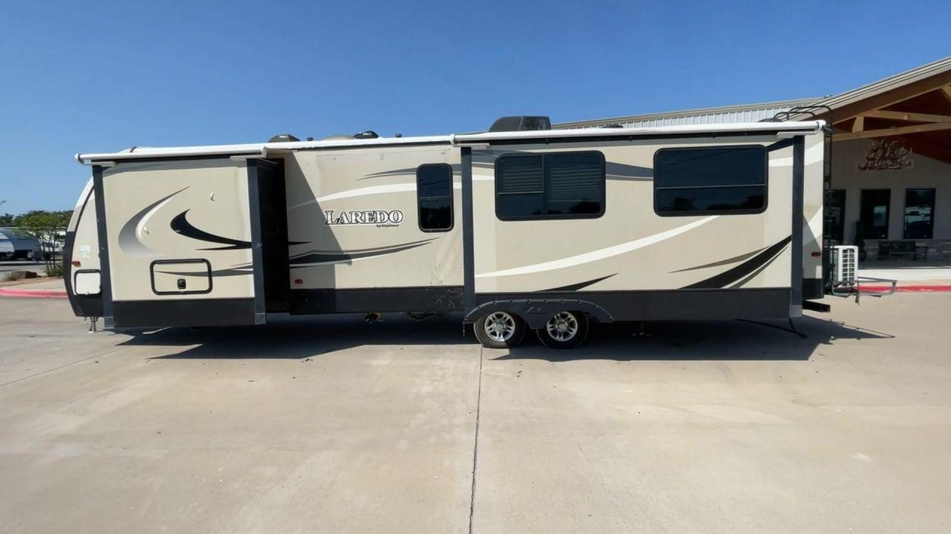 2018 KEYSTONE LAREDO 335MK (4YDT33524JV) , Length: 37.92 ft. | Dry Weight: 8,473 lbs. | Gross Weight: 10,000 lbs. | Slides: 2 transmission, located at 4319 N Main Street, Cleburne, TX, 76033, (817) 221-0660, 32.435829, -97.384178 - The 2018 Keystone Laredo 335MK is a spacious and feature-packed travel trailer with a length of 37.92 ft, a dry weight of 8,473 lbs, and a gross weight capacity of 10,000 lbs. It includes two large slide-outs, significantly expanding the living and kitchen areas. The exterior features a cream and be - Photo#6