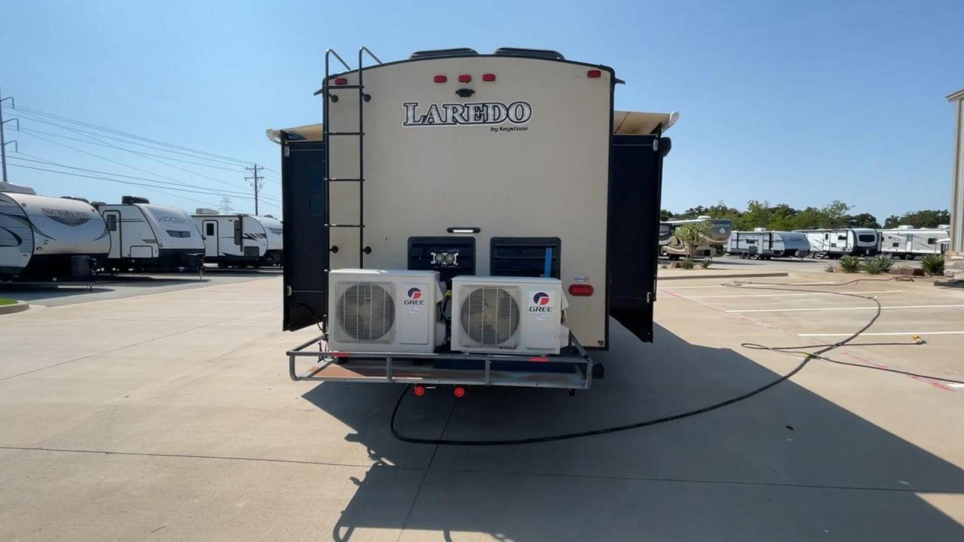 2018 KEYSTONE LAREDO 335MK (4YDT33524JV) , Length: 37.92 ft. | Dry Weight: 8,473 lbs. | Gross Weight: 10,000 lbs. | Slides: 2 transmission, located at 4319 N Main Street, Cleburne, TX, 76033, (817) 221-0660, 32.435829, -97.384178 - The 2018 Keystone Laredo 335MK is a spacious and feature-packed travel trailer with a length of 37.92 ft, a dry weight of 8,473 lbs, and a gross weight capacity of 10,000 lbs. It includes two large slide-outs, significantly expanding the living and kitchen areas. The exterior features a cream and be - Photo#8