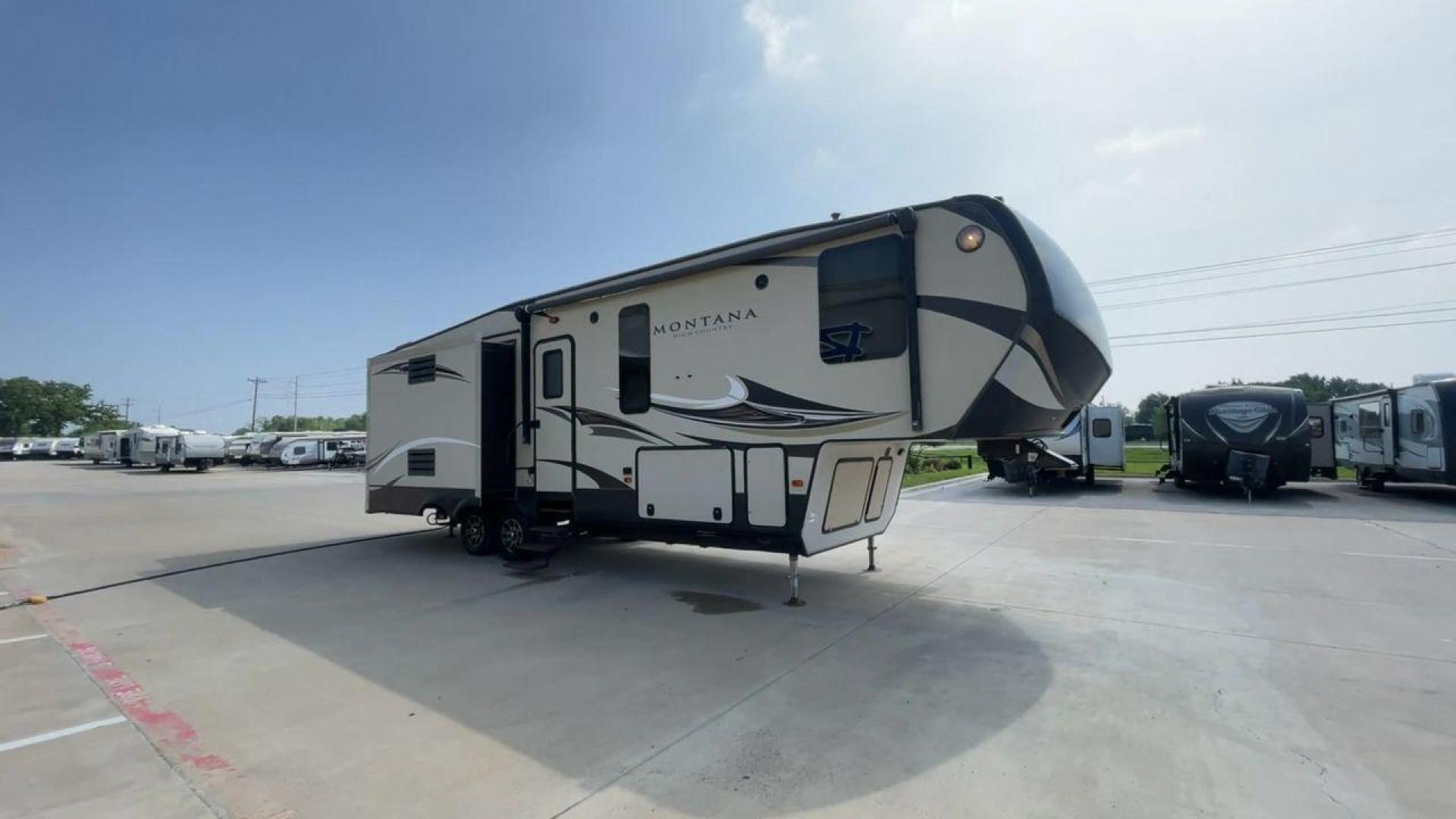 2018 TAN KEYSTONE MONTANA 305RL (4YDF3052XJA) , Length: 35.67 ft. | Dry Weight: 10,390 lbs. | Gross Weight: 14,270 lbs. | Slides: 3 transmission, located at 4319 N Main Street, Cleburne, TX, 76033, (817) 221-0660, 32.435829, -97.384178 - The 2018 Keystone Montana 305RL is a dual-axle aluminum wheel set-up that measures 35.67 ft. in length. It has a dry weight of 10,390 lbs. and a GVWR of 14,270 lbs. It is made of aluminum and fiberglass. It comes with automatic heating and cooling rated at 35,000 and 15,000 BTUs respectively. With 3 - Photo#3