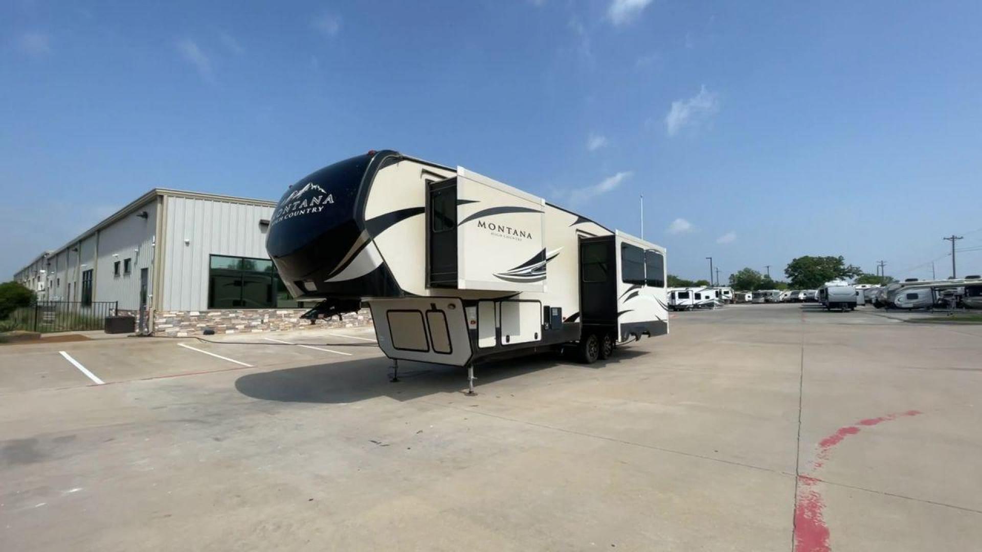 2018 TAN KEYSTONE MONTANA 305RL (4YDF3052XJA) , Length: 35.67 ft. | Dry Weight: 10,390 lbs. | Gross Weight: 14,270 lbs. | Slides: 3 transmission, located at 4319 N Main Street, Cleburne, TX, 76033, (817) 221-0660, 32.435829, -97.384178 - The 2018 Keystone Montana 305RL is a dual-axle aluminum wheel set-up that measures 35.67 ft. in length. It has a dry weight of 10,390 lbs. and a GVWR of 14,270 lbs. It is made of aluminum and fiberglass. It comes with automatic heating and cooling rated at 35,000 and 15,000 BTUs respectively. With 3 - Photo#5