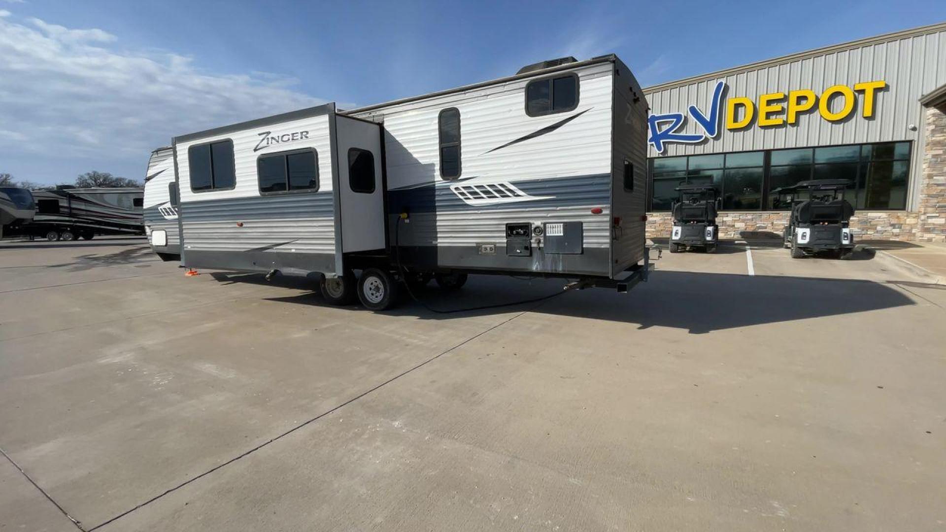 2018 GRAY KEYSTONE ZINGER 330BH (4YDT3302XJS) , Length: 37.5 ft. | Dry Weight: 7,980 lbs. | Gross Weight: 9,800 lbs. | Slides: 2 transmission, located at 4319 N Main Street, Cleburne, TX, 76033, (817) 221-0660, 32.435829, -97.384178 - This 2018 Keystone Zinger 330BH is a dual-axle steel wheel setup measuring 37.5 ft. long and 11.25 ft. tall. It has a dry weight of 7,980 lbs. and a GVWR of 9,800 lbs. It also comes with two slides as well as one 20-foot awning. This travel trailer is a bunkhouse model that offers sleeping space f - Photo#7