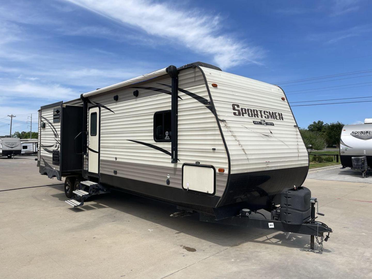 2018 BEIGE K-Z SPORTSMEN 333 BHK (4EZTS3320J5) , Length: 36.67 ft. | Dry Weight: 8,520 lbs. | Gross Weight: 9,995 lbs. | Slides: 3 transmission, located at 4319 N Main Street, Cleburne, TX, 76033, (817) 221-0660, 32.435829, -97.384178 - Wanting to explore the great outdoors with comfort and convenience? The 2018 KZ Sportsmen 333BHK travel trailer is an ideal camper for you! Featuring a rear private bunkhouse, triple slides, an outdoor kitchen, and so much more! This trailer measures approximately 36.67 ft in length, 8 ft in width, - Photo#22