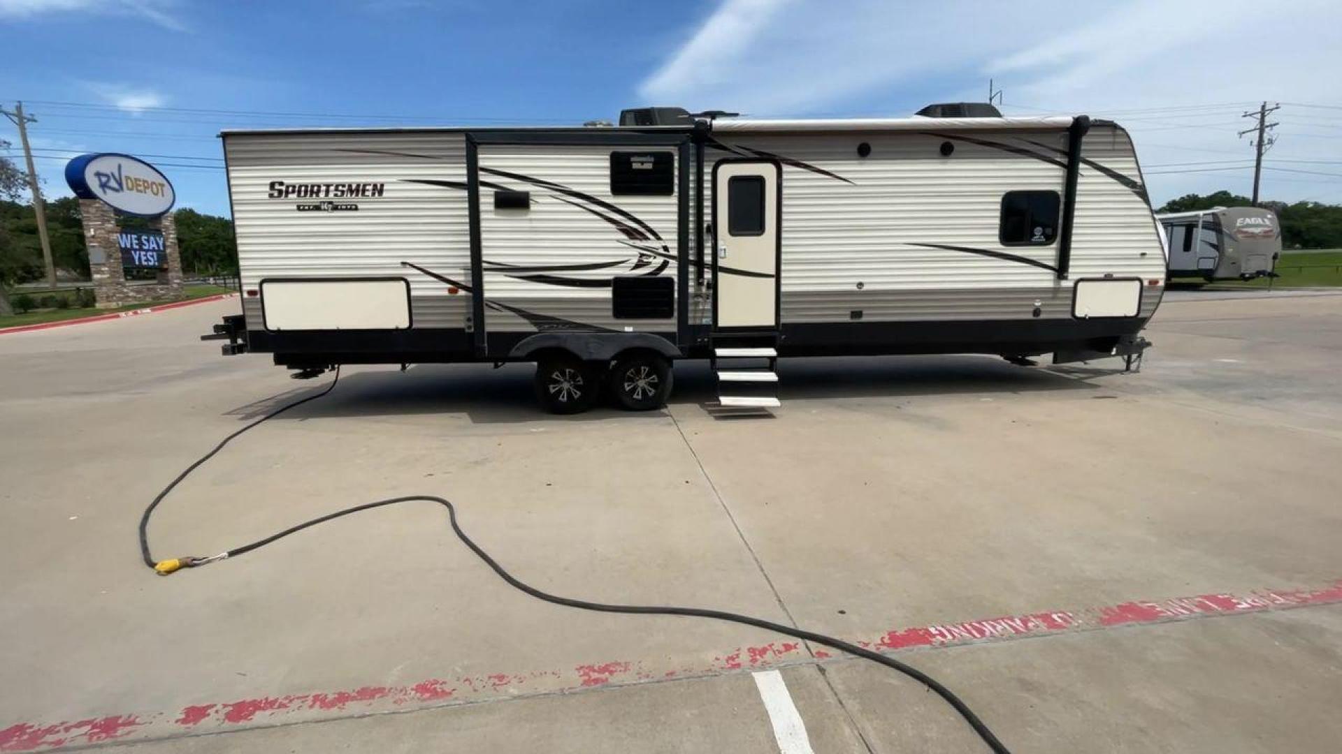 2018 BEIGE K-Z SPORTSMEN 333 BHK (4EZTS3320J5) , Length: 36.67 ft. | Dry Weight: 8,520 lbs. | Gross Weight: 9,995 lbs. | Slides: 3 transmission, located at 4319 N Main Street, Cleburne, TX, 76033, (817) 221-0660, 32.435829, -97.384178 - Wanting to explore the great outdoors with comfort and convenience? The 2018 KZ Sportsmen 333BHK travel trailer is an ideal camper for you! Featuring a rear private bunkhouse, triple slides, an outdoor kitchen, and so much more! This trailer measures approximately 36.67 ft in length, 8 ft in width, - Photo#2