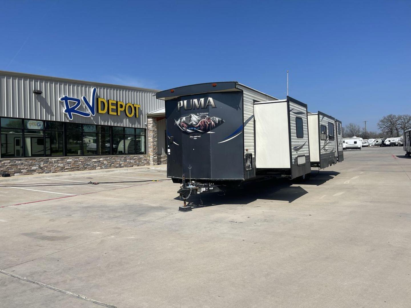 2018 PUMA 39PQB - (4X4TPUR2XJP) , located at 4319 N Main Street, Cleburne, TX, 76033, (817) 221-0660, 32.435829, -97.384178 - This Puma Travel Trailer measures just over 42 feet long and 8 feet wide with a dry weight of 10,709 lbs. It has a GVWR of 13,413 lbs and a hitch weight of 1,413 lbs. This unit comes with automatic heating and cooling rated at 35,000 and 13,500 BTUs respectively. The exterior of this unit is a base - Photo#0