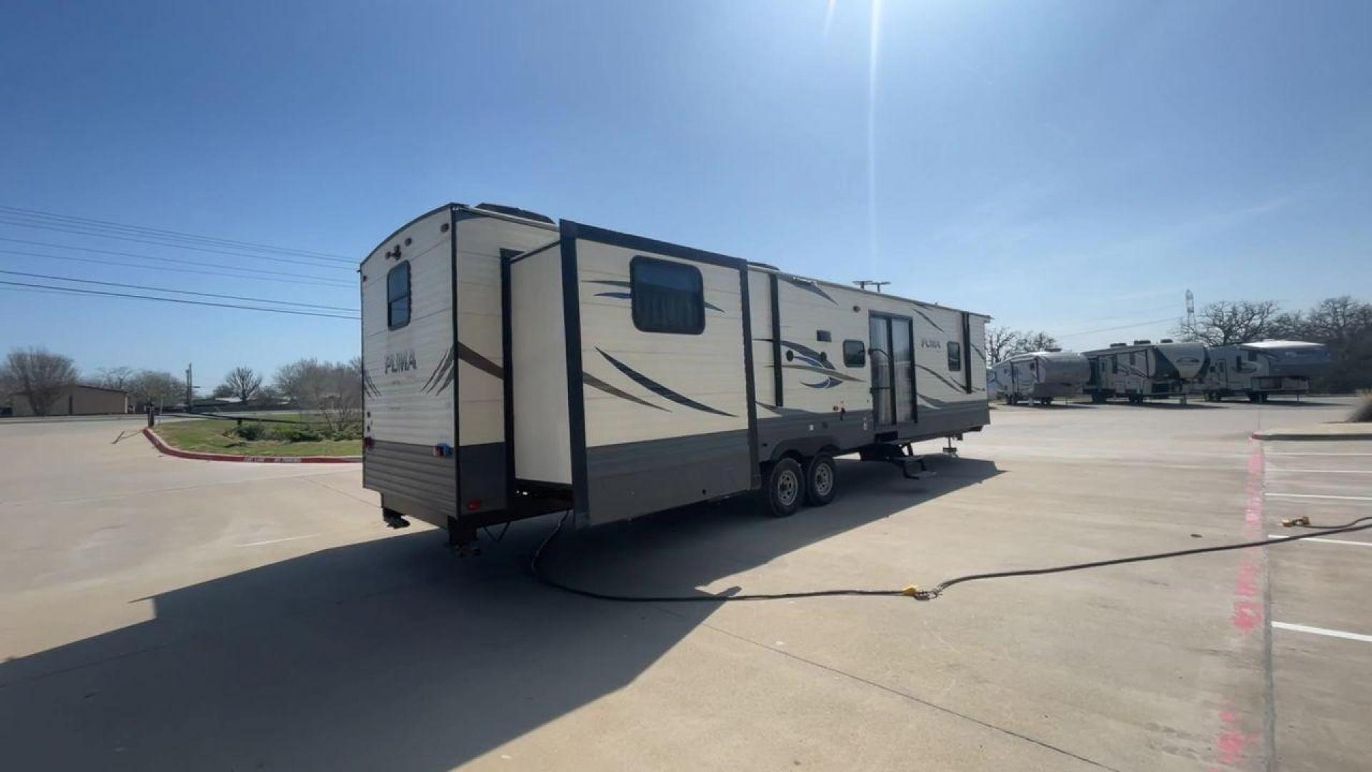 2018 PUMA 39PQB - (4X4TPUR2XJP) , located at 4319 N Main Street, Cleburne, TX, 76033, (817) 221-0660, 32.435829, -97.384178 - This Puma Travel Trailer measures just over 42 feet long and 8 feet wide with a dry weight of 10,709 lbs. It has a GVWR of 13,413 lbs and a hitch weight of 1,413 lbs. This unit comes with automatic heating and cooling rated at 35,000 and 13,500 BTUs respectively. The exterior of this unit is a base - Photo#1