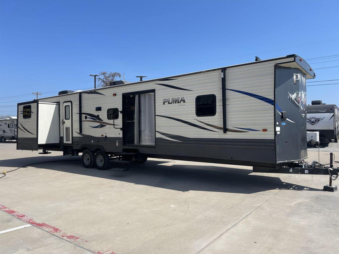 2018 PUMA 39PQB - (4X4TPUR2XJP) , located at 4319 N Main Street, Cleburne, TX, 76033, (817) 221-0660, 32.435829, -97.384178 - This Puma Travel Trailer measures just over 42 feet long and 8 feet wide with a dry weight of 10,709 lbs. It has a GVWR of 13,413 lbs and a hitch weight of 1,413 lbs. This unit comes with automatic heating and cooling rated at 35,000 and 13,500 BTUs respectively. The exterior of this unit is a base - Photo#23