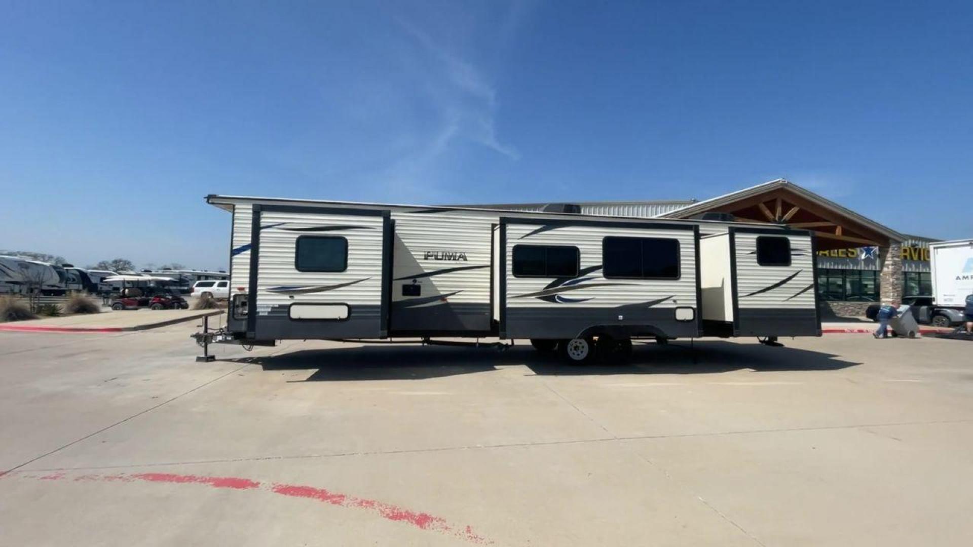 2018 PUMA 39PQB - (4X4TPUR2XJP) , located at 4319 N Main Street, Cleburne, TX, 76033, (817) 221-0660, 32.435829, -97.384178 - This Puma Travel Trailer measures just over 42 feet long and 8 feet wide with a dry weight of 10,709 lbs. It has a GVWR of 13,413 lbs and a hitch weight of 1,413 lbs. This unit comes with automatic heating and cooling rated at 35,000 and 13,500 BTUs respectively. The exterior of this unit is a base - Photo#6