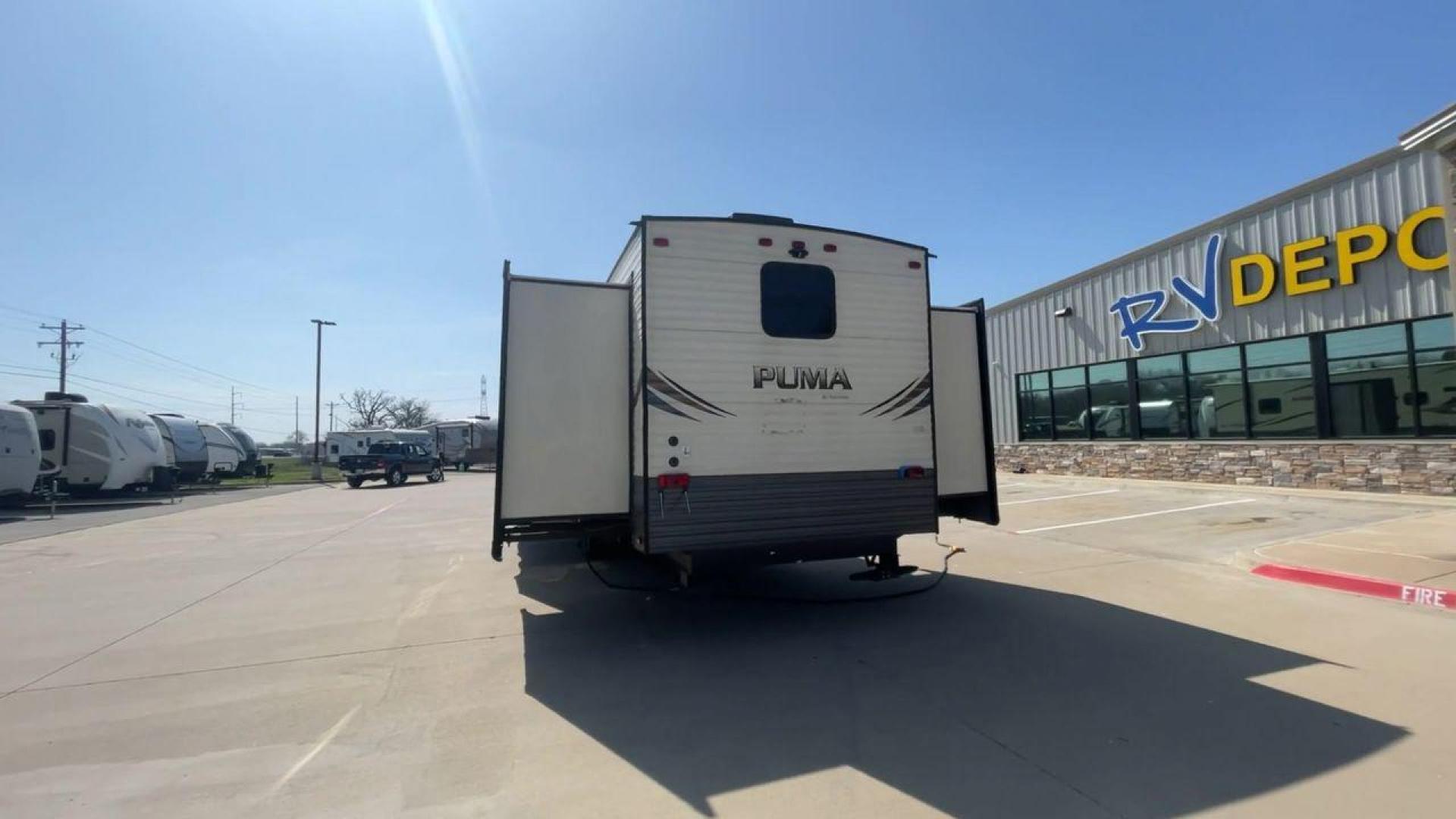 2018 PUMA 39PQB - (4X4TPUR2XJP) , located at 4319 N Main Street, Cleburne, TX, 76033, (817) 221-0660, 32.435829, -97.384178 - This Puma Travel Trailer measures just over 42 feet long and 8 feet wide with a dry weight of 10,709 lbs. It has a GVWR of 13,413 lbs and a hitch weight of 1,413 lbs. This unit comes with automatic heating and cooling rated at 35,000 and 13,500 BTUs respectively. The exterior of this unit is a base - Photo#8