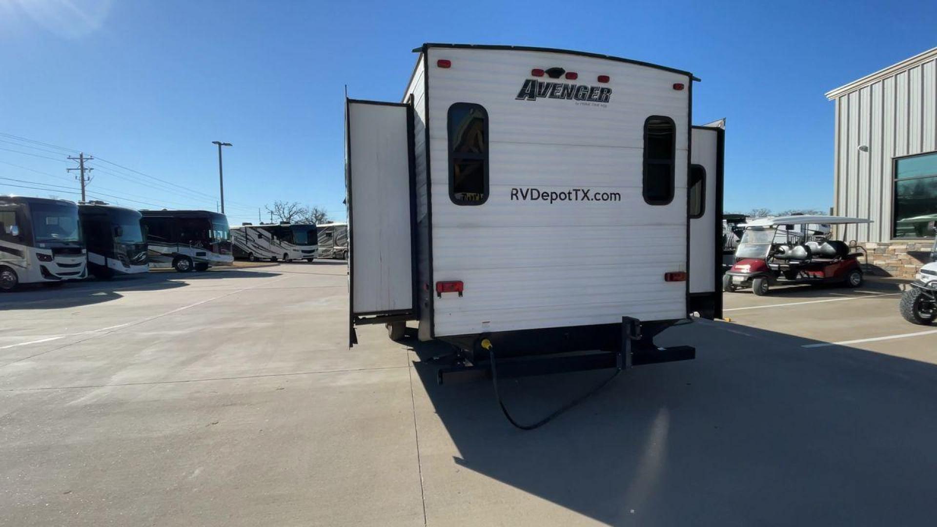 2019 TAN FOREST RIVER AVENGER 32DEN (5ZT2AVXB6KB) , Length: 37.92 ft. | Dry Weight: 7,989 lbs. | Slides: 2 transmission, located at 4319 N Main Street, Cleburne, TX, 76033, (817) 221-0660, 32.435829, -97.384178 - Measuring an impressive 36 feet, this model unfolds to reveal two strategically placed slide-outs, creating a spacious haven for relaxation. The master bedroom welcomes you with a queen-size bed and ample storage, ensuring a peaceful retreat after a day of outdoor exploration. The living area is a h - Photo#8