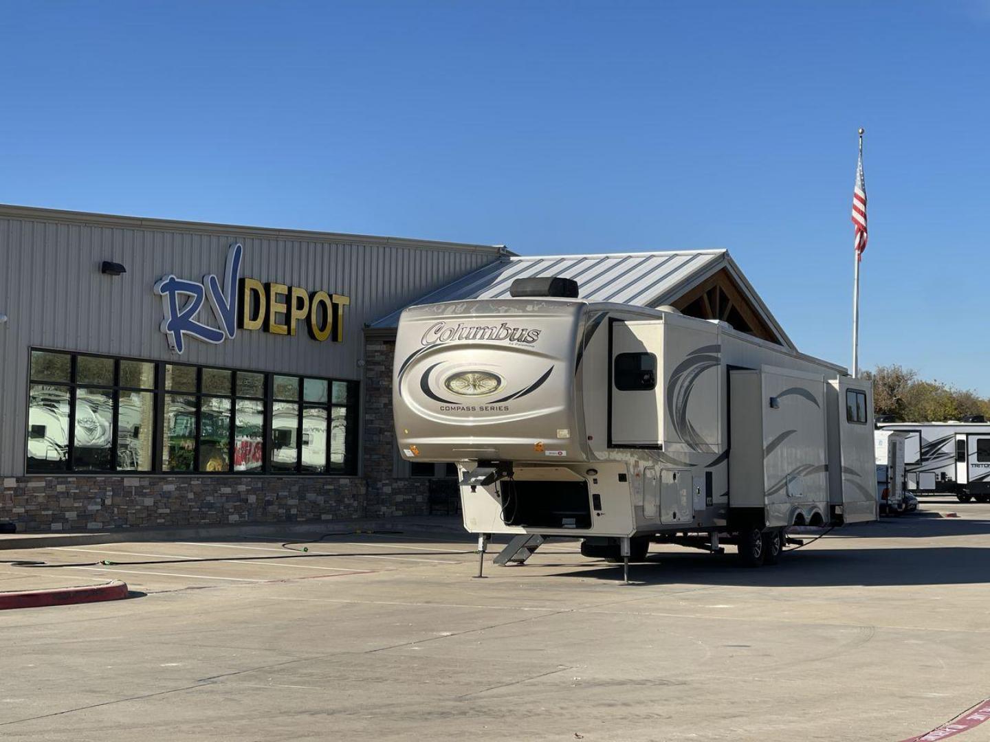 2019 FOREST RIVER COLUMBUS 374BHC (4X4FCMN21K6) , Length: 42.08 ft. | Dry Weight: 12,785 lbs. | Gross Weight: 15,785 lbs. | Slides: 4 transmission, located at 4319 N Main Street, Cleburne, TX, 76033, (817) 221-0660, 32.435829, -97.384178 - The 2019 Forest River Columbus 374BHC is a spacious fifth-wheel travel trailer with a length of 42.08 feet. Its exterior features a smooth beige finish with stylish curved graphics in dark gray and black, giving it a modern and attractive look. The unit has four slides which significantly increases - Photo#0