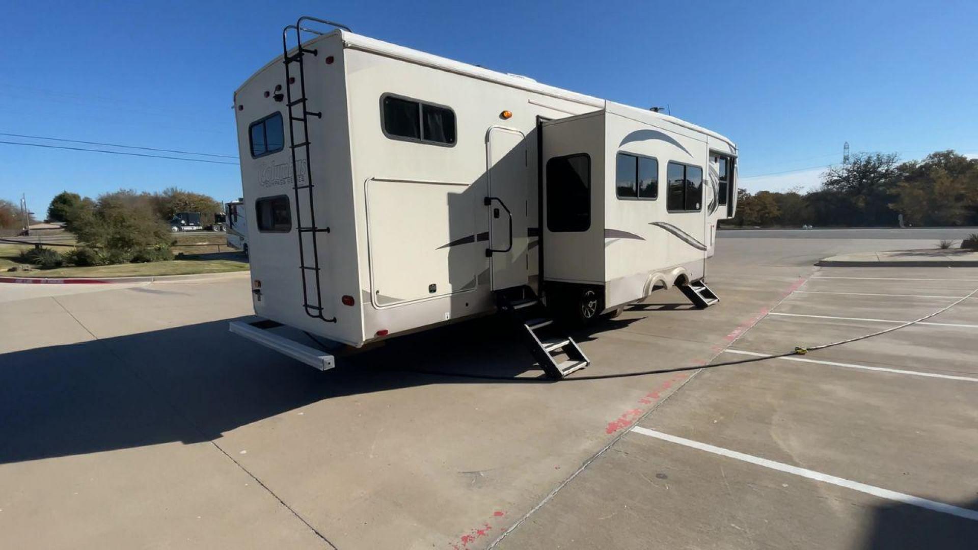 2019 FOREST RIVER COLUMBUS 374BHC (4X4FCMN21K6) , Length: 42.08 ft. | Dry Weight: 12,785 lbs. | Gross Weight: 15,785 lbs. | Slides: 4 transmission, located at 4319 N Main Street, Cleburne, TX, 76033, (817) 221-0660, 32.435829, -97.384178 - The 2019 Forest River Columbus 374BHC is a spacious fifth-wheel travel trailer with a length of 42.08 feet. Its exterior features a smooth beige finish with stylish curved graphics in dark gray and black, giving it a modern and attractive look. The unit has four slides which significantly increases - Photo#1