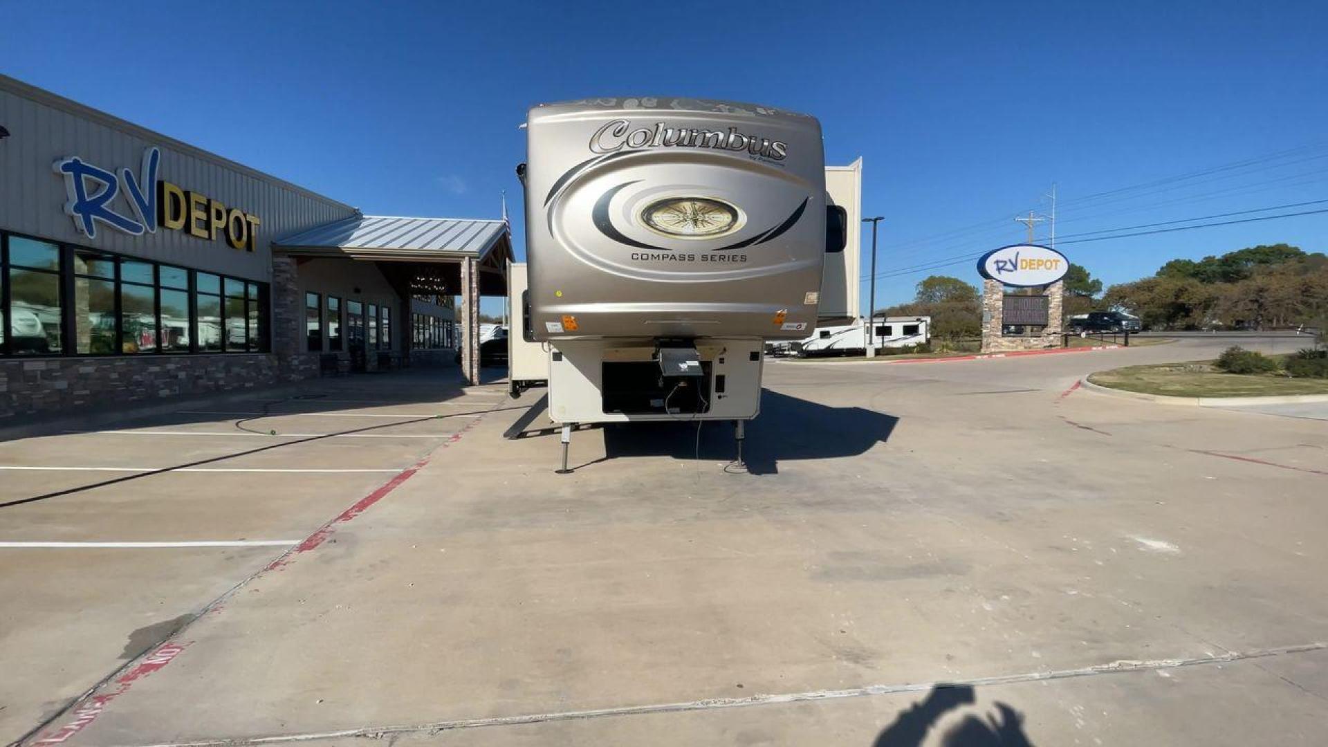 2019 FOREST RIVER COLUMBUS 374BHC (4X4FCMN21K6) , Length: 42.08 ft. | Dry Weight: 12,785 lbs. | Gross Weight: 15,785 lbs. | Slides: 4 transmission, located at 4319 N Main Street, Cleburne, TX, 76033, (817) 221-0660, 32.435829, -97.384178 - The 2019 Forest River Columbus 374BHC is a spacious fifth-wheel travel trailer with a length of 42.08 feet. Its exterior features a smooth beige finish with stylish curved graphics in dark gray and black, giving it a modern and attractive look. The unit has four slides which significantly increases - Photo#4