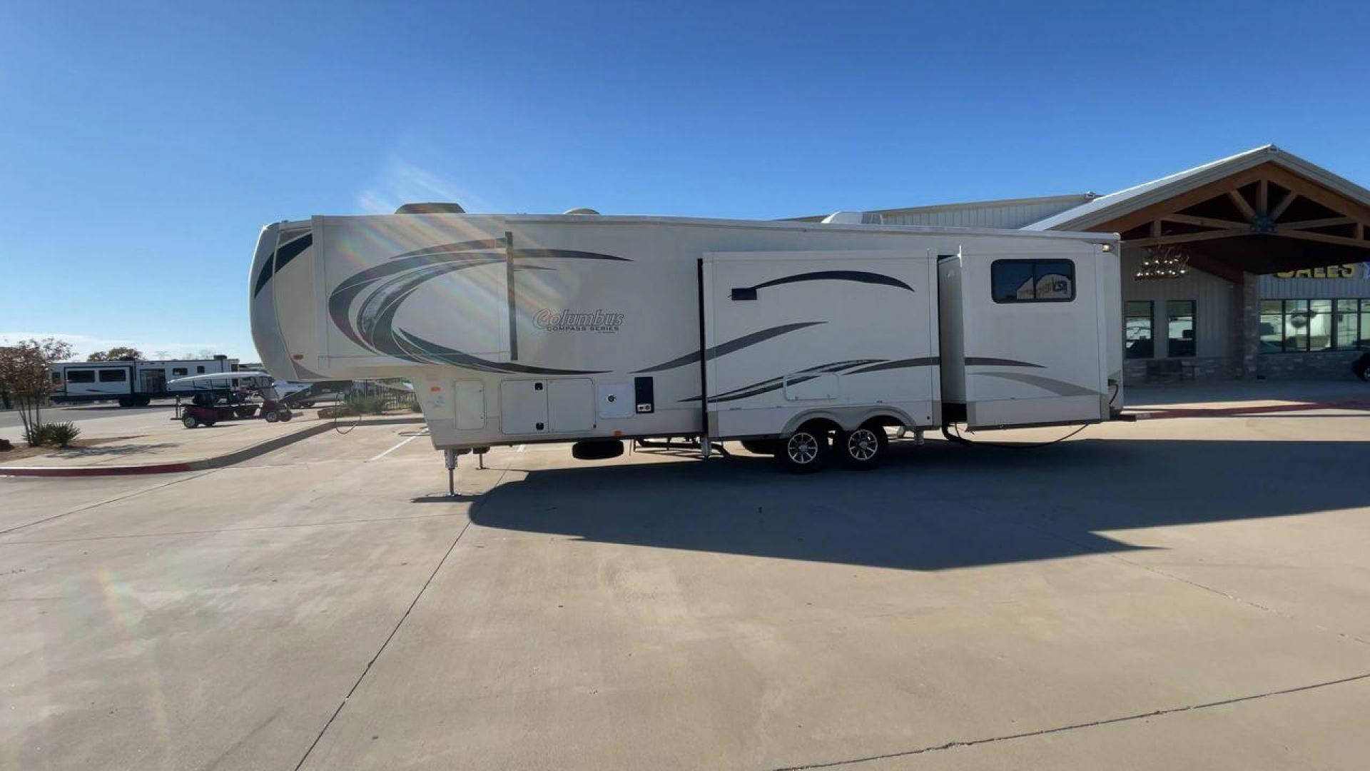 2019 FOREST RIVER COLUMBUS 374BHC (4X4FCMN21K6) , Length: 42.08 ft. | Dry Weight: 12,785 lbs. | Gross Weight: 15,785 lbs. | Slides: 4 transmission, located at 4319 N Main Street, Cleburne, TX, 76033, (817) 221-0660, 32.435829, -97.384178 - The 2019 Forest River Columbus 374BHC is a spacious fifth-wheel travel trailer with a length of 42.08 feet. Its exterior features a smooth beige finish with stylish curved graphics in dark gray and black, giving it a modern and attractive look. The unit has four slides which significantly increases - Photo#6