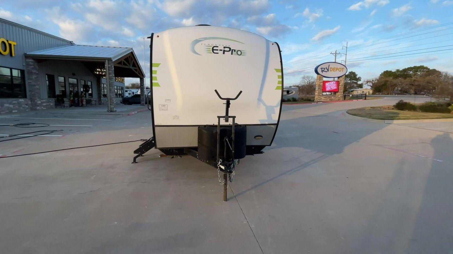 2019 FOREST RIVER FLAGSTAFF E-PRO 16BH (5ZT2FSEC3K3) , Length: 18.33 ft. | Dry Weight: 2,993 lbs. | Slides: 1 transmission, located at 4319 N Main Street, Cleburne, TX, 76033, (817) 221-0660, 32.435829, -97.384178 - The 2019 Forest River Flagstaff E-Pro 16BH is a compact, lightweight travel trailer designed for adventure. Its exterior features a sleek and modern design with a white body accented by bold green graphics, giving it a fresh and sporty look. The single slide-out on the driver's side provides additio - Photo#4