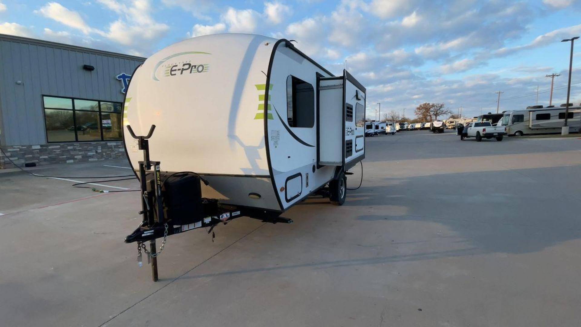 2019 FOREST RIVER FLAGSTAFF E-PRO 16BH (5ZT2FSEC3K3) , Length: 18.33 ft. | Dry Weight: 2,993 lbs. | Slides: 1 transmission, located at 4319 N Main Street, Cleburne, TX, 76033, (817) 221-0660, 32.435829, -97.384178 - The 2019 Forest River Flagstaff E-Pro 16BH is a compact, lightweight travel trailer designed for adventure. Its exterior features a sleek and modern design with a white body accented by bold green graphics, giving it a fresh and sporty look. The single slide-out on the driver's side provides additio - Photo#5