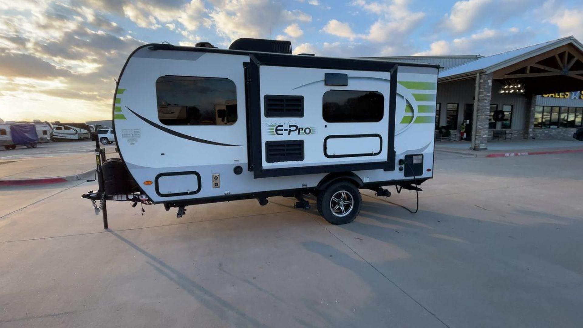 2019 FOREST RIVER FLAGSTAFF E-PRO 16BH (5ZT2FSEC3K3) , Length: 18.33 ft. | Dry Weight: 2,993 lbs. | Slides: 1 transmission, located at 4319 N Main Street, Cleburne, TX, 76033, (817) 221-0660, 32.435829, -97.384178 - The 2019 Forest River Flagstaff E-Pro 16BH is a compact, lightweight travel trailer designed for adventure. Its exterior features a sleek and modern design with a white body accented by bold green graphics, giving it a fresh and sporty look. The single slide-out on the driver's side provides additio - Photo#6