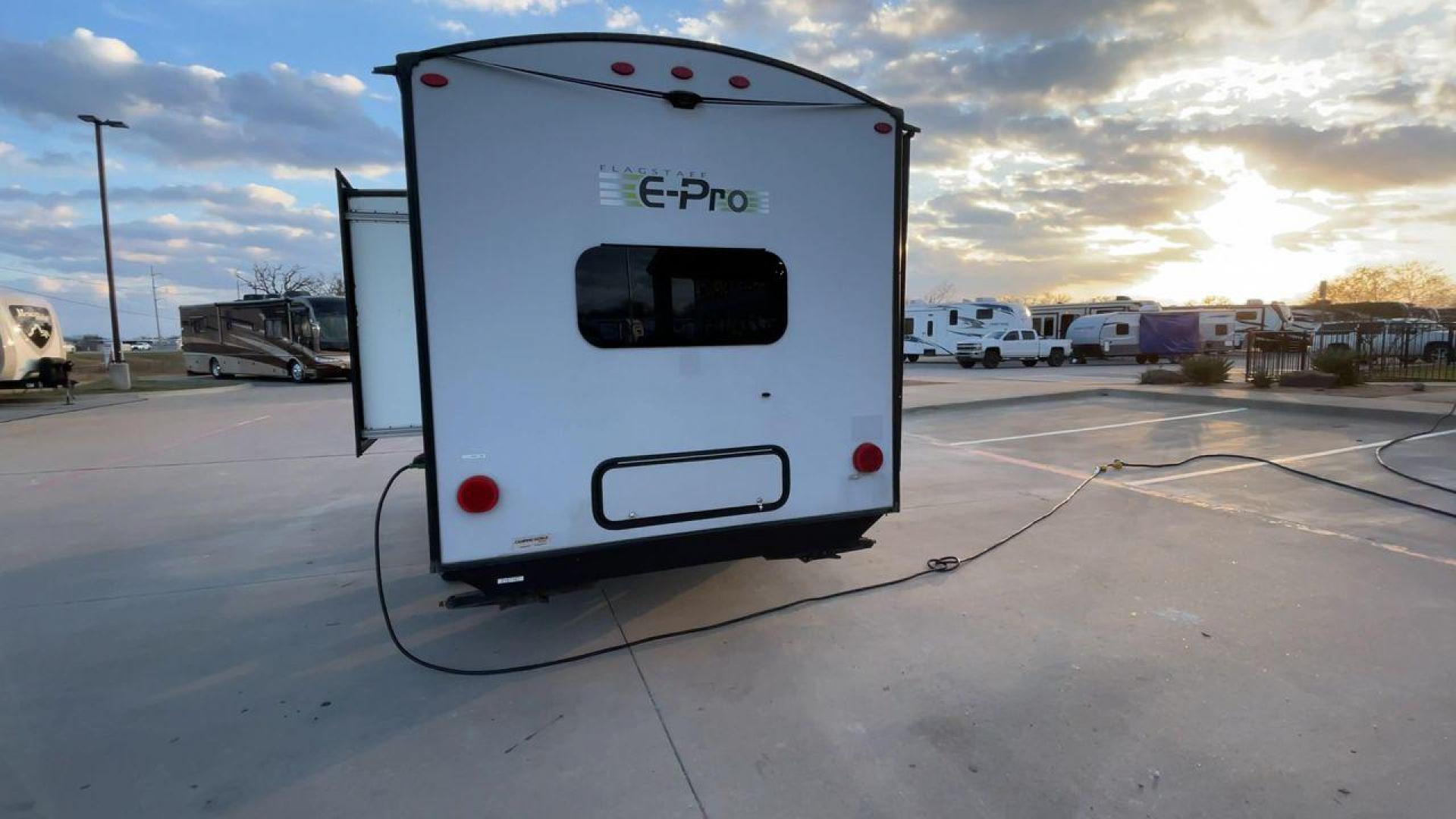 2019 FOREST RIVER FLAGSTAFF E-PRO 16BH (5ZT2FSEC3K3) , Length: 18.33 ft. | Dry Weight: 2,993 lbs. | Slides: 1 transmission, located at 4319 N Main Street, Cleburne, TX, 76033, (817) 221-0660, 32.435829, -97.384178 - The 2019 Forest River Flagstaff E-Pro 16BH is a compact, lightweight travel trailer designed for adventure. Its exterior features a sleek and modern design with a white body accented by bold green graphics, giving it a fresh and sporty look. The single slide-out on the driver's side provides additio - Photo#8