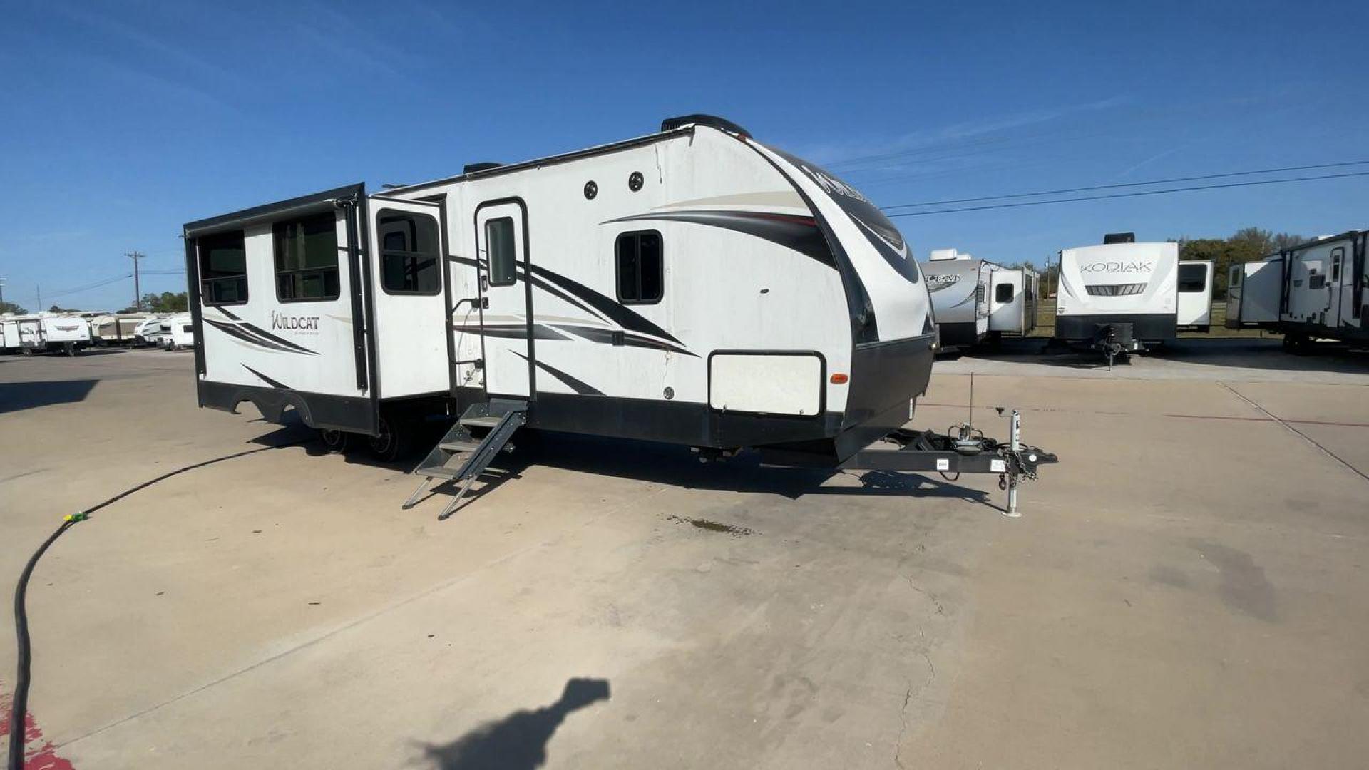 2019 WHITE FOREST RIVER WILDCAT 343BIK (5ZT2WCZB1KB) , Length: 37.42 ft. | Dry Weight: 8,226 lbs. | Slides: 3 transmission, located at 4319 N Main Street, Cleburne, TX, 76033, (817) 221-0660, 32.435829, -97.384178 - The 2019 Forest River Wildcat 343BIK is a triple slide travel trailer that measures 37.42 ft. in length. It has a dry weight of 8,226 lbs. and a payload capacity of 3,002 lbs. It is made of aluminum and fiberglass. It comes with automatic heating and cooling rated at 30,000 and 15,000 BTUs respectiv - Photo#3