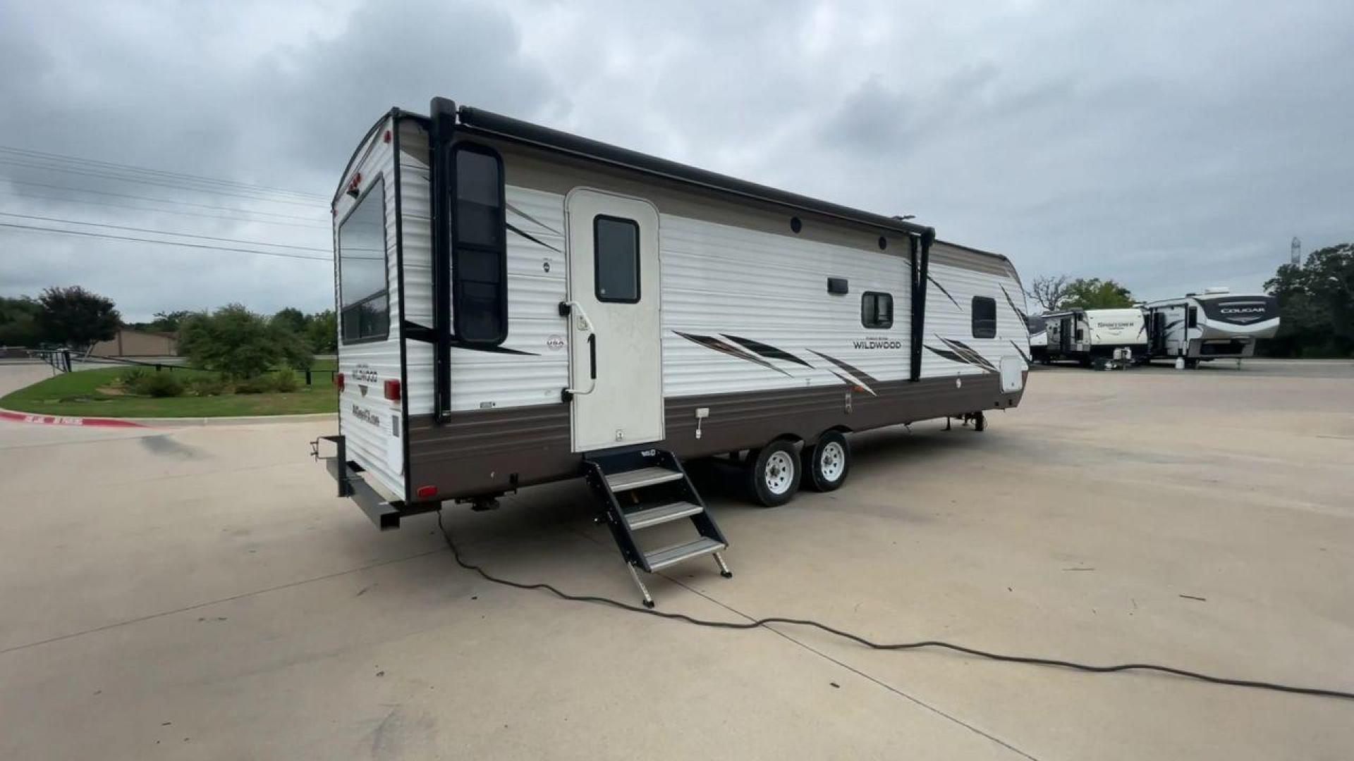 2019 FOREST RIVER WILDWOOD 28RLSS (4X4TWDD27KA) , Length: 34.75 ft. | Dry Weight: 7,075 lbs. | Slides: 1 transmission, located at 4319 N Main Street, Cleburne, TX, 76033, (817) 221-0660, 32.435829, -97.384178 - This 2019 Forest River Wildwood 28RLSS is a dual-axle steel wheel setup measuring 34.75 ft. long and 11.25 ft. tall. It has a dry weight of 7,075 lbs. and a payload capacity of 2,913 lbs. It includes one slide as well as one awning. This travel trailer features a spacious combined living and kitc - Photo#1