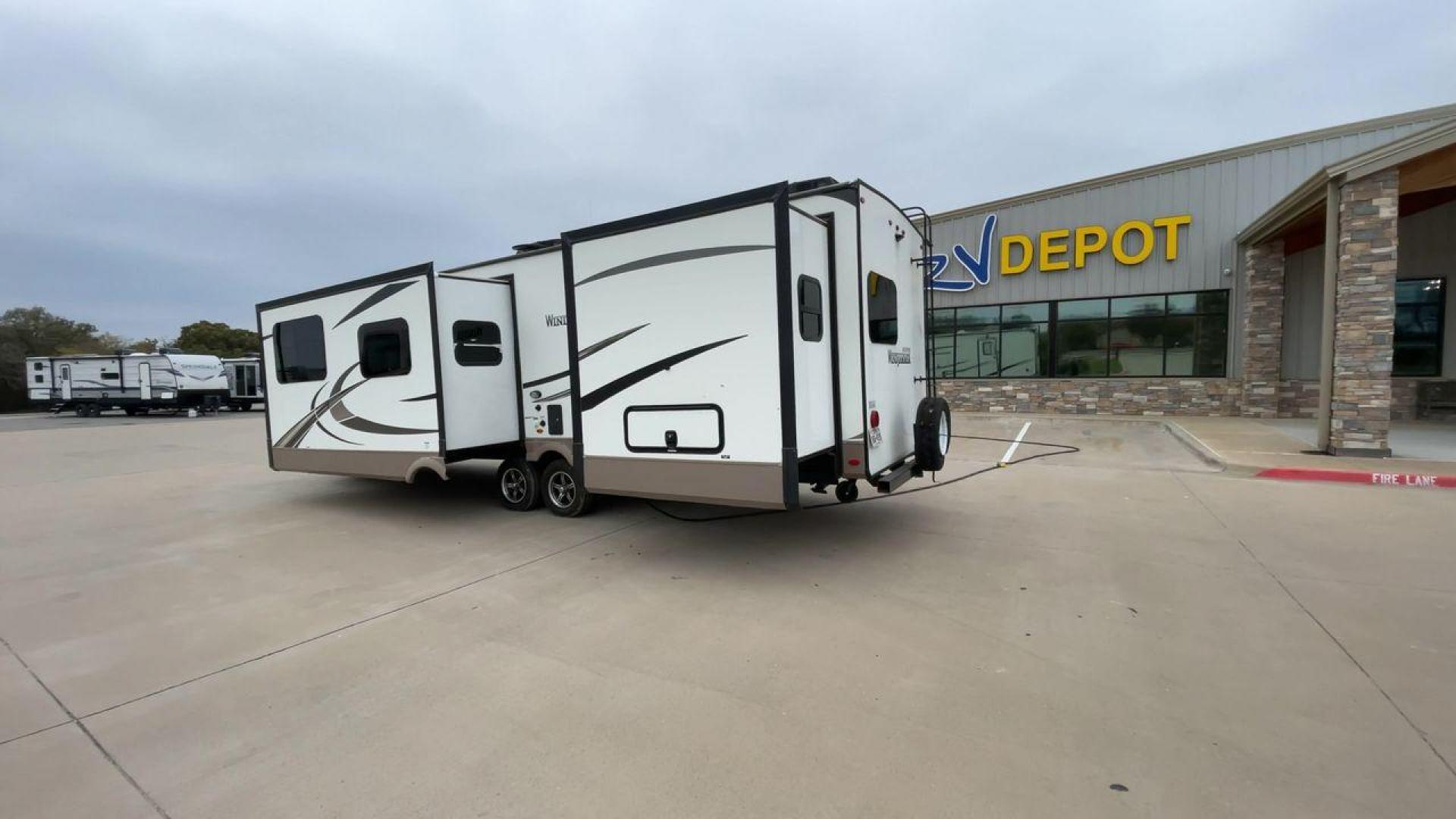 2019 FOREST RIVER WINDJAMMER 3008V (4X4TRLF24K1) , Length: 34 ft | Dry Weight: 7,433 lbs | Slides: 2 transmission, located at 4319 N Main Street, Cleburne, TX, 76033, (817) 221-0660, 32.435829, -97.384178 - Measuring 34 ft long, the 2019 Forest River Windjammer 3008V travel trailer is sleek and modern. The body features a white fiberglass surface accented with brown and black decals that provide a stylish and aerodynamic look. The front of the trailer is distinct with its pointed V-nose design. This en - Photo#7