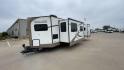 2019 FOREST RIVER WINDJAMMER 3008V (4X4TRLF24K1) , Length: 34 ft | Dry Weight: 7,433 lbs | Slides: 2 transmission, located at 4319 N Main Street, Cleburne, TX, 76033, (817) 221-0660, 32.435829, -97.384178 - Measuring 34 ft long, the 2019 Forest River Windjammer 3008V travel trailer is sleek and modern. The body features a white fiberglass surface accented with brown and black decals that provide a stylish and aerodynamic look. The front of the trailer is distinct with its pointed V-nose design. This en - Photo#5