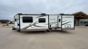 2019 FOREST RIVER WINDJAMMER 3008V (4X4TRLF24K1) , Length: 34 ft | Dry Weight: 7,433 lbs | Slides: 2 transmission, located at 4319 N Main Street, Cleburne, TX, 76033, (817) 221-0660, 32.435829, -97.384178 - Measuring 34 ft long, the 2019 Forest River Windjammer 3008V travel trailer is sleek and modern. The body features a white fiberglass surface accented with brown and black decals that provide a stylish and aerodynamic look. The front of the trailer is distinct with its pointed V-nose design. This en - Photo#6