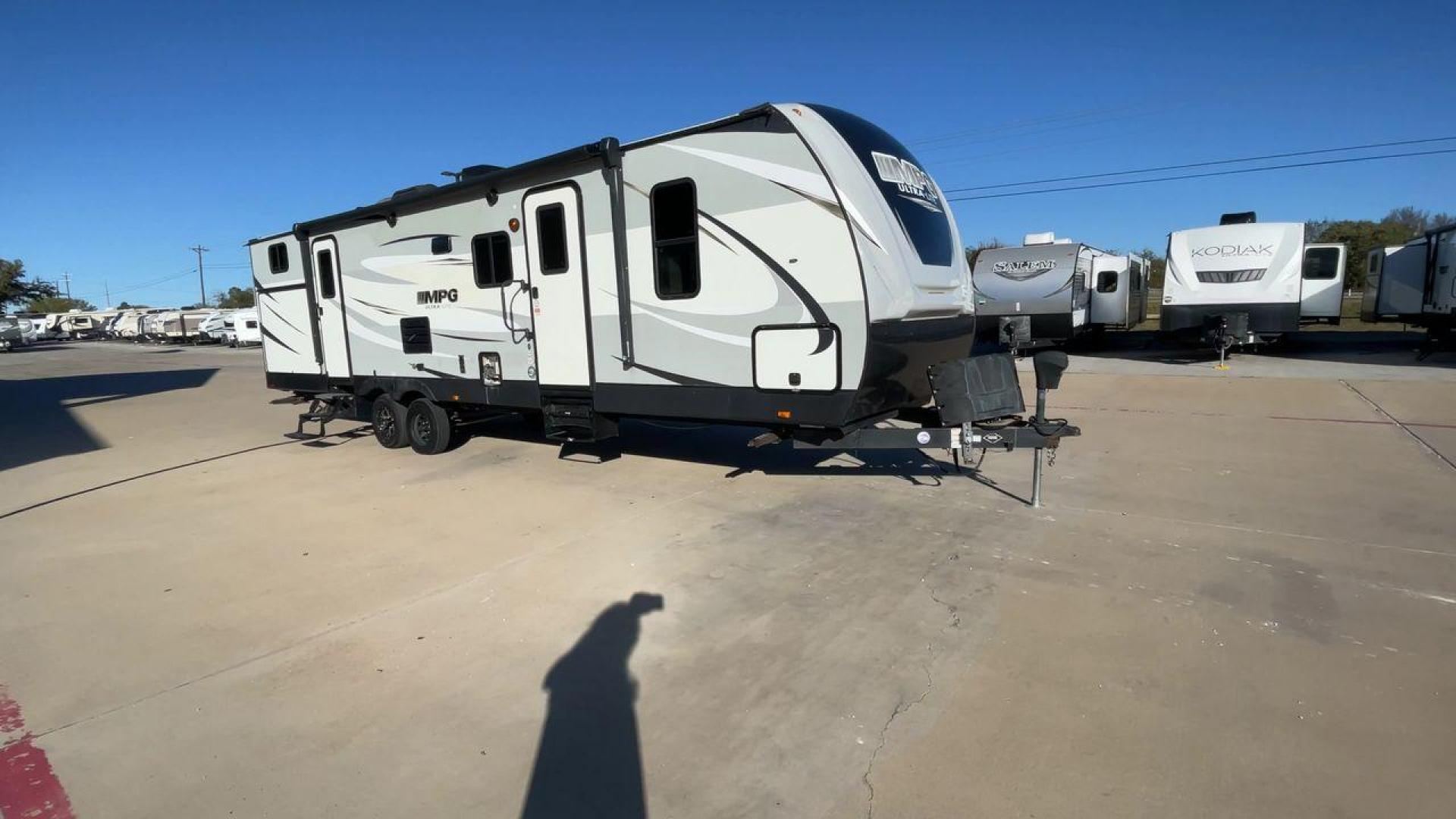 2019 HEARTLAND MPG 3100BH (5RXHB362XK2) , Length: 36.42 ft. | Dry Weight: 6,930 lbs. | Gross Weight: 9,655 lbs. | Slides: 2 transmission, located at 4319 N Main Street, Cleburne, TX, 76033, (817) 221-0660, 32.435829, -97.384178 - The 2019 Heartland MPG 3100BH travel trailer features an impressive exterior with a sleek, modern design. It measures 36.42 feet in length, providing ample space while maintaining a manageable profile for towing. The trailer includes two slideouts, which enhance the living space when parked. The tra - Photo#3