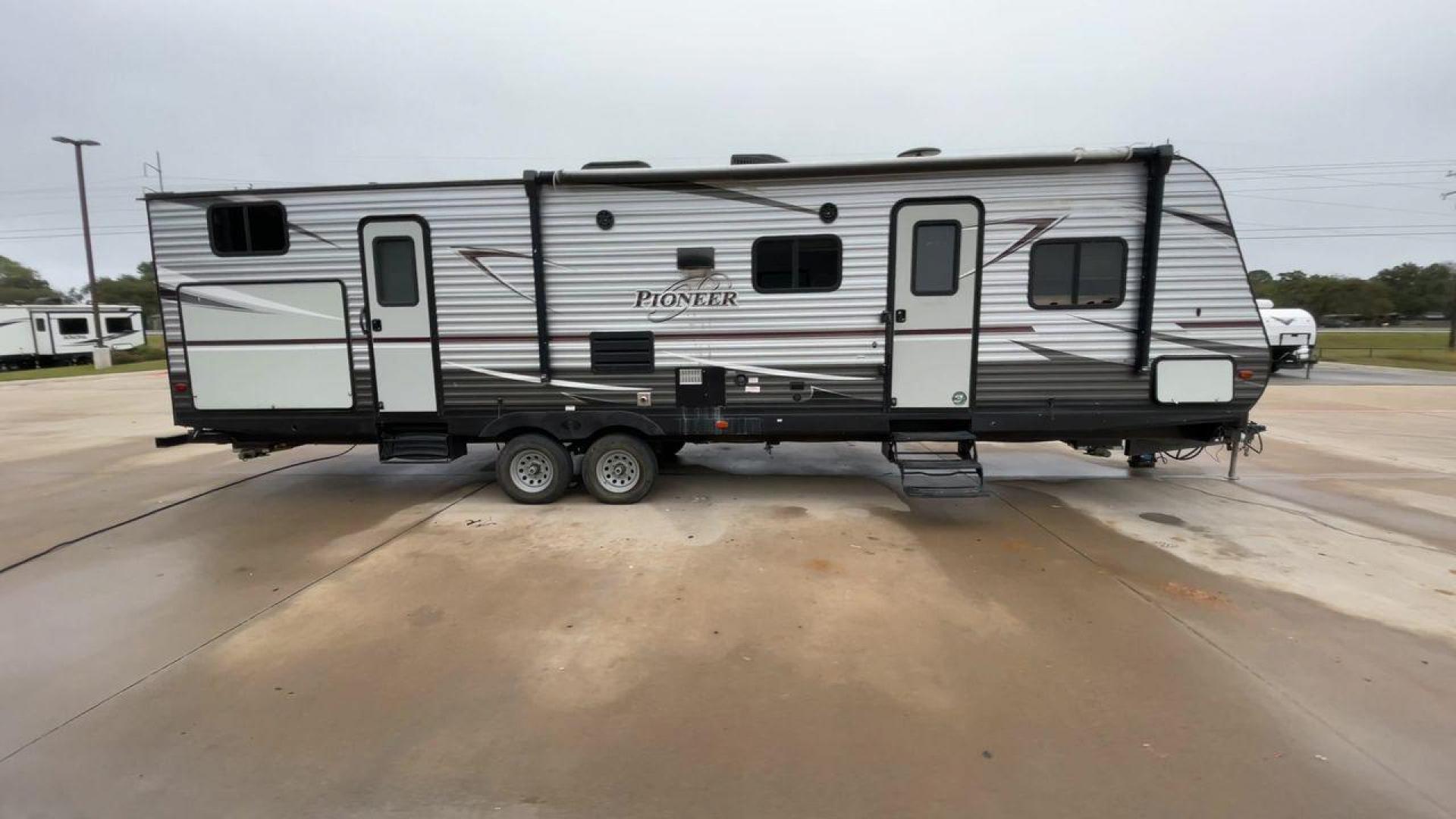 2019 GRAY HEARTLAND PIONEER DS320 (5SFPB3723KE) , Length: 37 ft. | Dry Weight: 7,612 lbs. | Slides: 2 transmission, located at 4319 N Main Street, Cleburne, TX, 76033, (817) 221-0660, 32.435829, -97.384178 - The 2019 Heartland Pioneer DS320 is designed to provide comfort and practicality for adventurers. Measuring 37 feet in length, this RV offers ample space for families or groups. Its dry weight of 7,612 lbs makes it towable by a variety of vehicles while maintaining stability on the road. This unit f - Photo#2