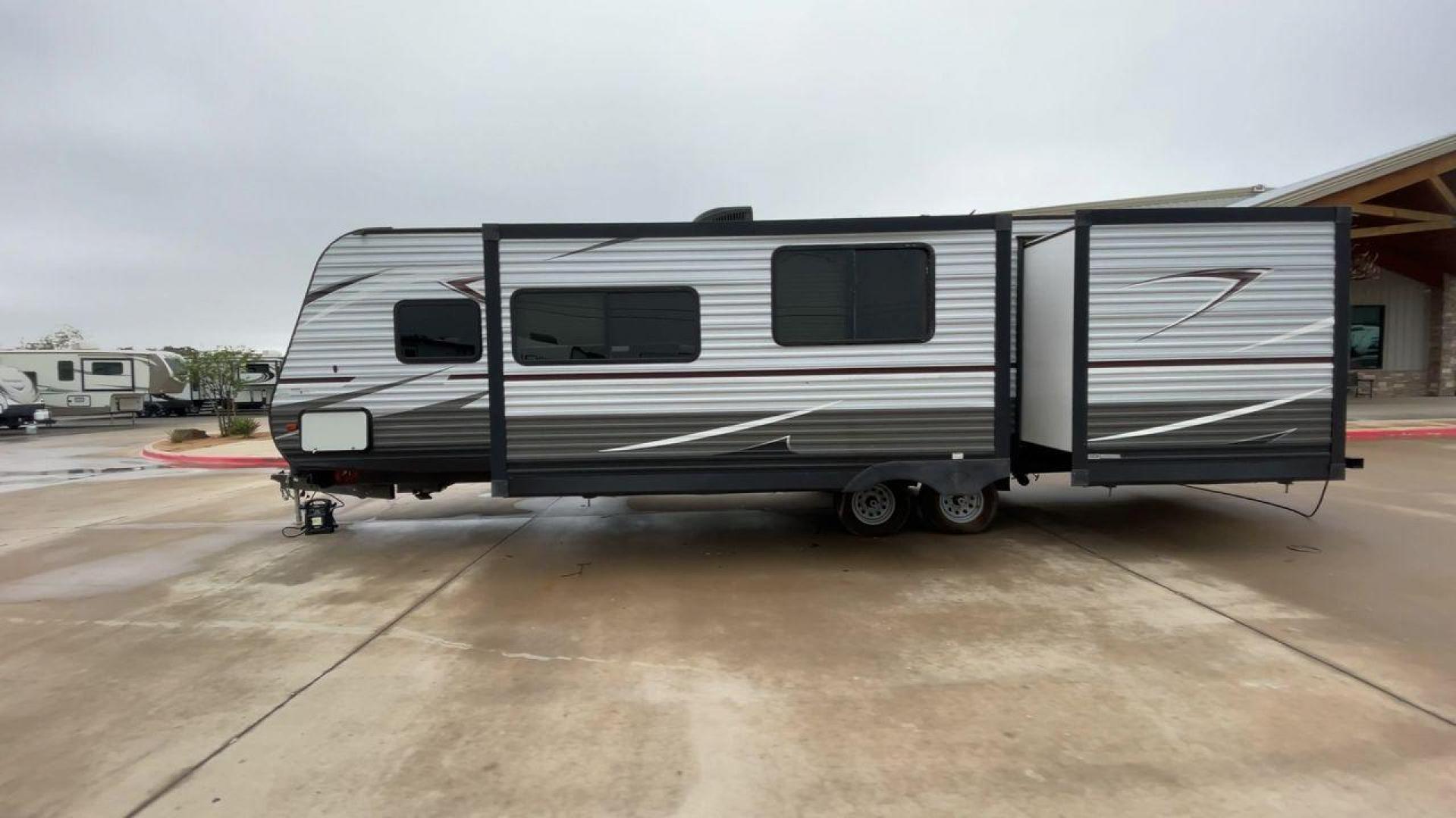 2019 GRAY HEARTLAND PIONEER DS320 (5SFPB3723KE) , Length: 37 ft. | Dry Weight: 7,612 lbs. | Slides: 2 transmission, located at 4319 N Main Street, Cleburne, TX, 76033, (817) 221-0660, 32.435829, -97.384178 - The 2019 Heartland Pioneer DS320 is designed to provide comfort and practicality for adventurers. Measuring 37 feet in length, this RV offers ample space for families or groups. Its dry weight of 7,612 lbs makes it towable by a variety of vehicles while maintaining stability on the road. This unit f - Photo#6