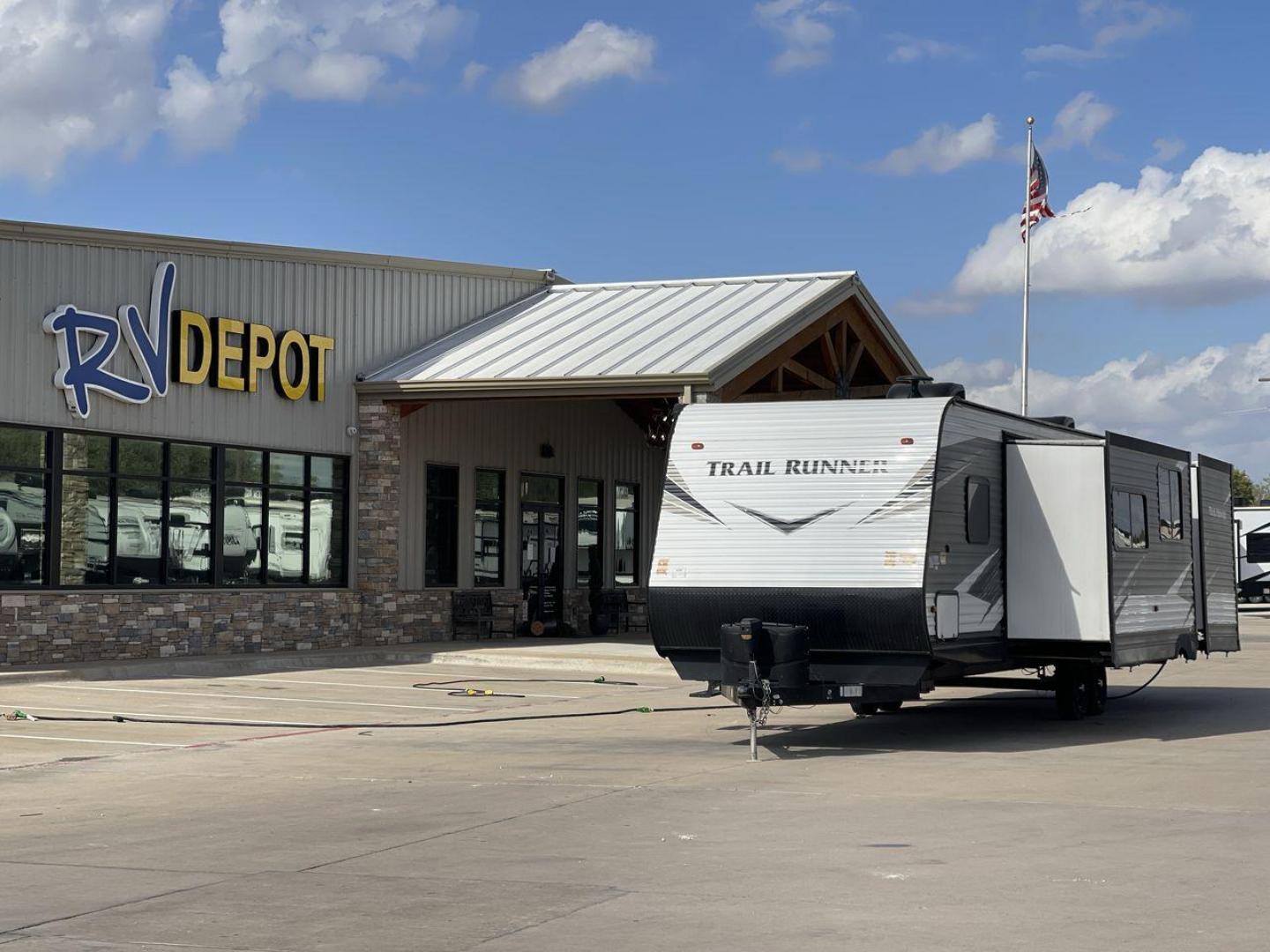 2019 HEARTLAND TRAIL RUNNER 325ODK (5SFEB3624KE) , Length: 36.3 ft. | Dry Weight: 7,724 lbs. | Slides: 2 transmission, located at 4319 N Main Street, Cleburne, TX, 76033, (817) 221-0660, 32.435829, -97.384178 - The 2019 Heartland Trail Runner 325ODK is a spacious travel trailer built for family comfort, with a unique bunkhouse, roomy living area, and outdoor kitchen. This model is perfect for families who enjoy extended trips with the convenience of home-like amenities. The dimensions of this unit are 36.3 - Photo#0