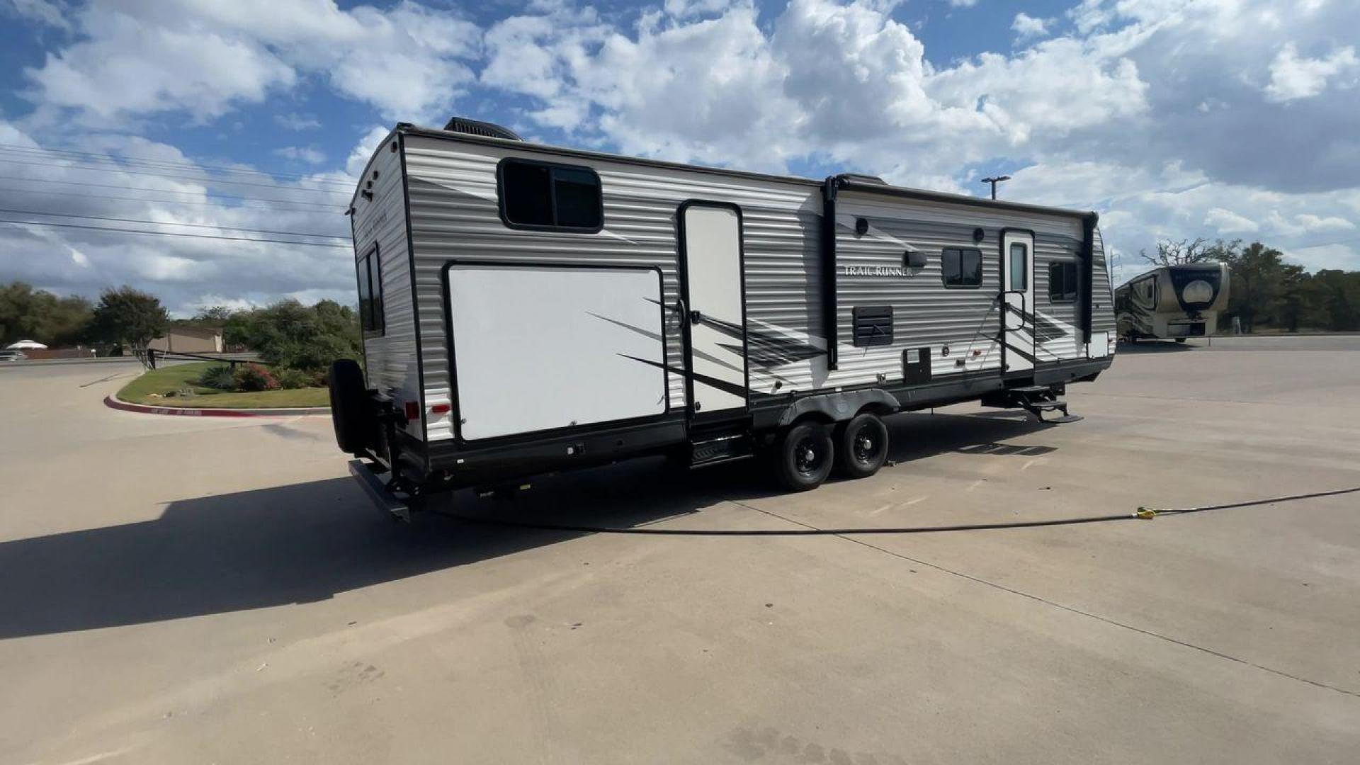 2019 HEARTLAND TRAIL RUNNER 325ODK (5SFEB3624KE) , Length: 36.3 ft. | Dry Weight: 7,724 lbs. | Slides: 2 transmission, located at 4319 N Main Street, Cleburne, TX, 76033, (817) 221-0660, 32.435829, -97.384178 - The 2019 Heartland Trail Runner 325ODK is a spacious travel trailer built for family comfort, with a unique bunkhouse, roomy living area, and outdoor kitchen. This model is perfect for families who enjoy extended trips with the convenience of home-like amenities. The dimensions of this unit are 36.3 - Photo#1