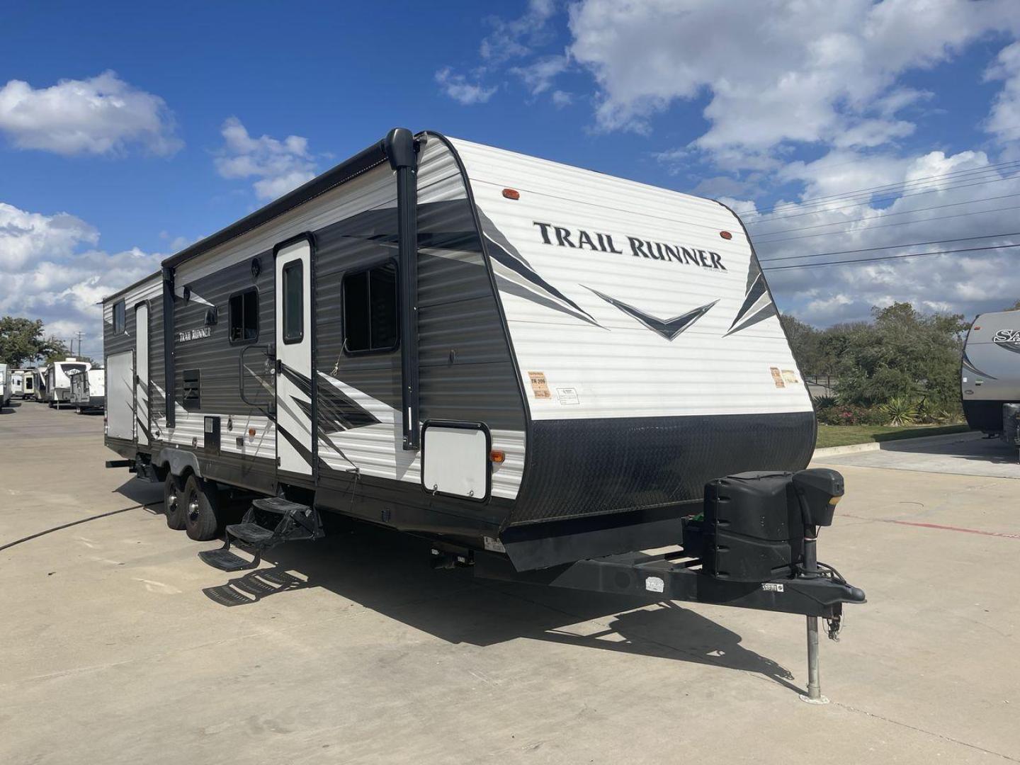 2019 HEARTLAND TRAIL RUNNER 325ODK (5SFEB3624KE) , Length: 36.3 ft. | Dry Weight: 7,724 lbs. | Slides: 2 transmission, located at 4319 N Main Street, Cleburne, TX, 76033, (817) 221-0660, 32.435829, -97.384178 - The 2019 Heartland Trail Runner 325ODK is a spacious travel trailer built for family comfort, with a unique bunkhouse, roomy living area, and outdoor kitchen. This model is perfect for families who enjoy extended trips with the convenience of home-like amenities. The dimensions of this unit are 36.3 - Photo#23