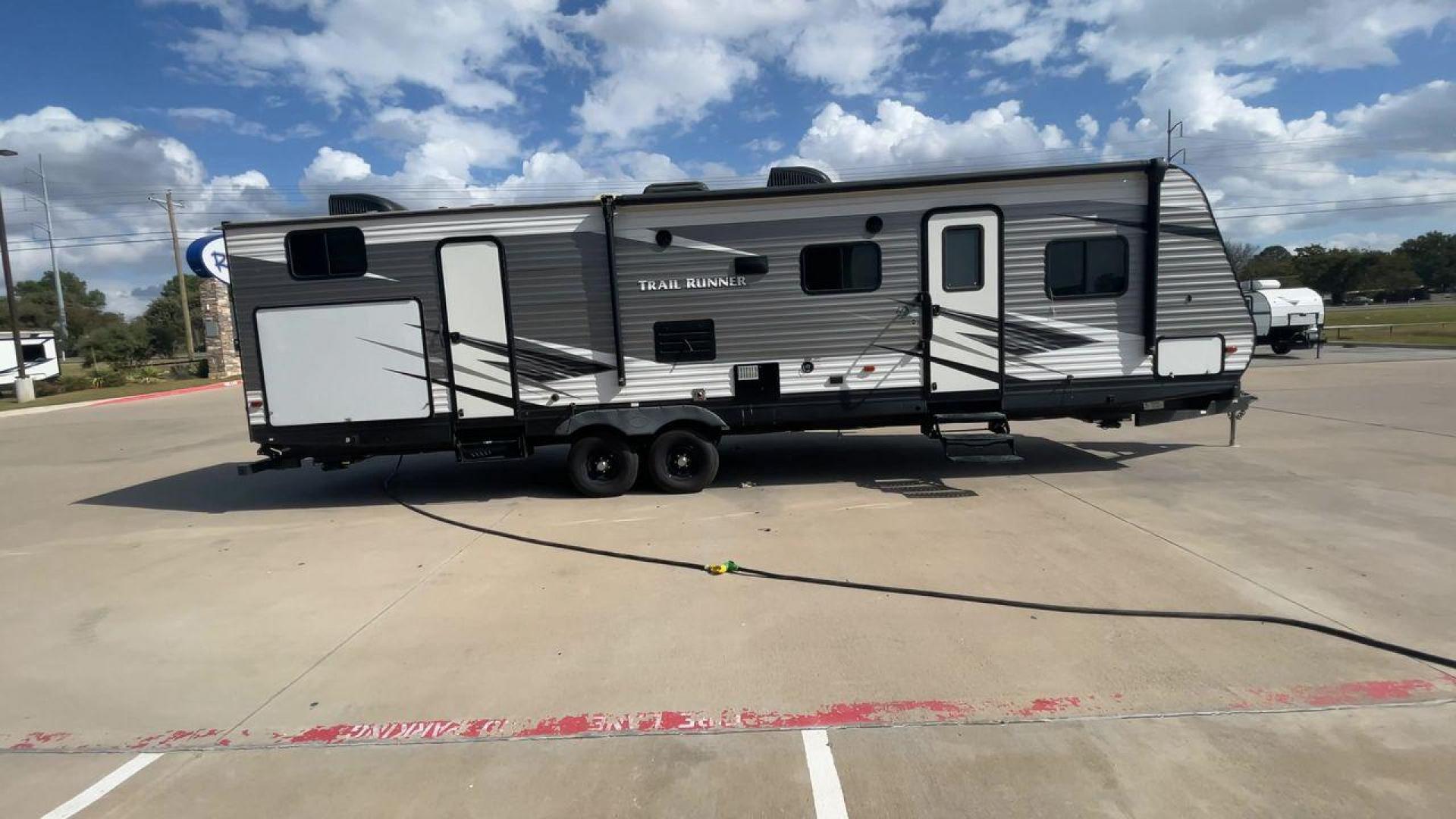 2019 HEARTLAND TRAIL RUNNER 325ODK (5SFEB3624KE) , Length: 36.3 ft. | Dry Weight: 7,724 lbs. | Slides: 2 transmission, located at 4319 N Main Street, Cleburne, TX, 76033, (817) 221-0660, 32.435829, -97.384178 - The 2019 Heartland Trail Runner 325ODK is a spacious travel trailer built for family comfort, with a unique bunkhouse, roomy living area, and outdoor kitchen. This model is perfect for families who enjoy extended trips with the convenience of home-like amenities. The dimensions of this unit are 36.3 - Photo#2