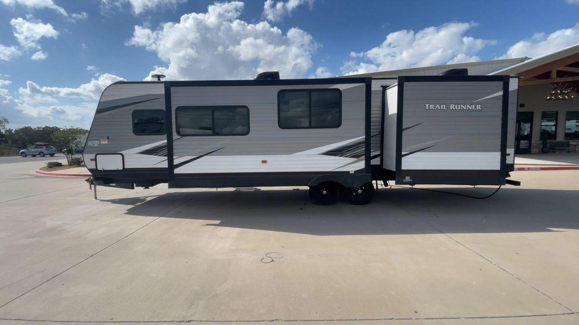 2019 HEARTLAND TRAIL RUNNER 325ODK (5SFEB3624KE) , Length: 36.3 ft. | Dry Weight: 7,724 lbs. | Slides: 2 transmission, located at 4319 N Main Street, Cleburne, TX, 76033, (817) 221-0660, 32.435829, -97.384178 - The 2019 Heartland Trail Runner 325ODK is a spacious travel trailer built for family comfort, with a unique bunkhouse, roomy living area, and outdoor kitchen. This model is perfect for families who enjoy extended trips with the convenience of home-like amenities. The dimensions of this unit are 36.3 - Photo#6