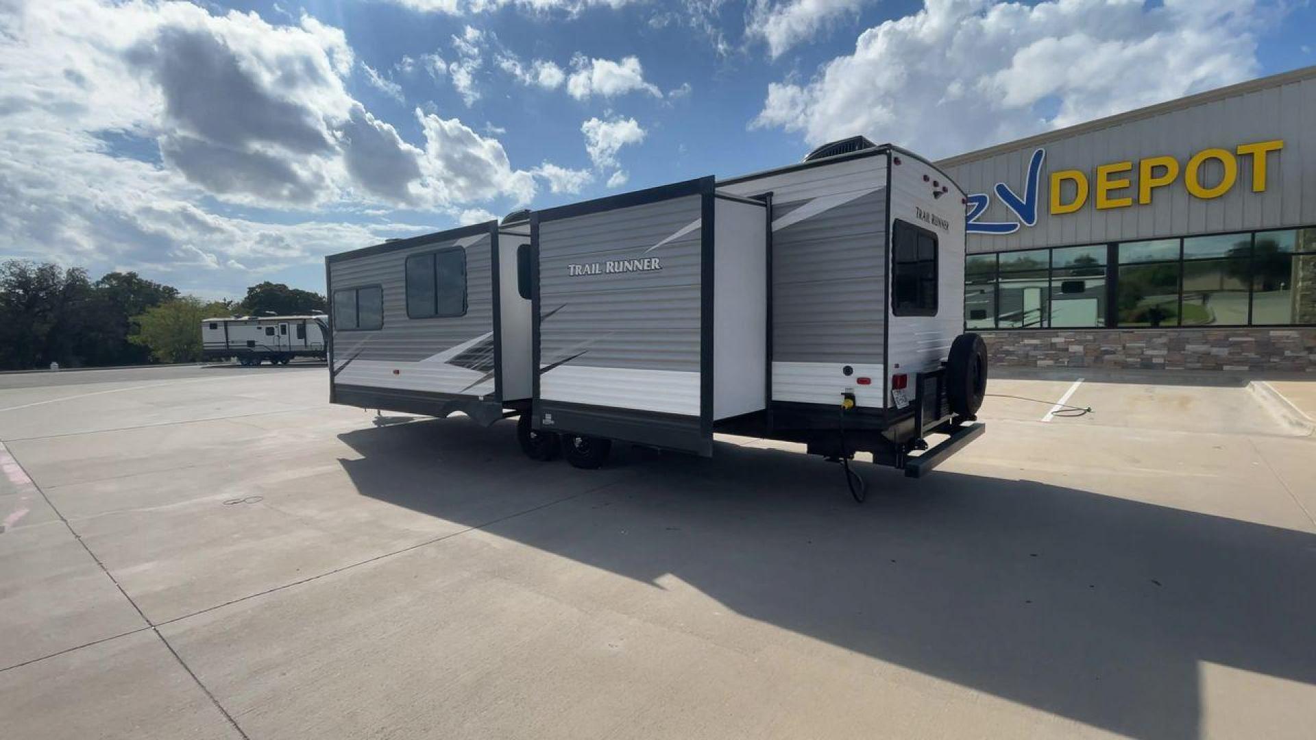 2019 HEARTLAND TRAIL RUNNER 325ODK (5SFEB3624KE) , Length: 36.3 ft. | Dry Weight: 7,724 lbs. | Slides: 2 transmission, located at 4319 N Main Street, Cleburne, TX, 76033, (817) 221-0660, 32.435829, -97.384178 - The 2019 Heartland Trail Runner 325ODK is a spacious travel trailer built for family comfort, with a unique bunkhouse, roomy living area, and outdoor kitchen. This model is perfect for families who enjoy extended trips with the convenience of home-like amenities. The dimensions of this unit are 36.3 - Photo#7