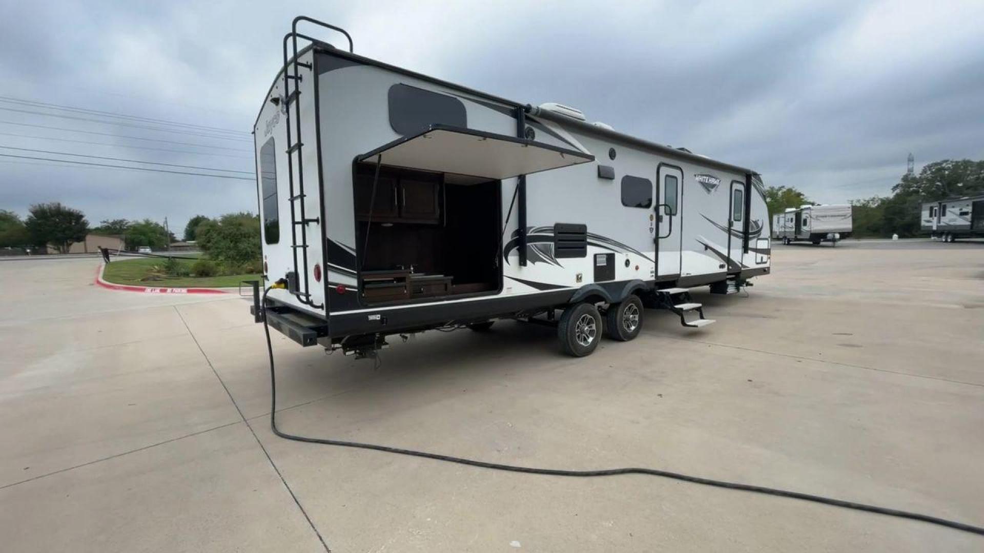 2019 JAYCO WHITE HAWK 31BH (1UJBJ0BT7K1) , Length: 37.5 ft. | Dry Weight: 7,715 lbs. | Gross Weight: 9,500 lbs. | Slides: 2 transmission, located at 4319 N Main Street, Cleburne, TX, 76033, (817) 221-0660, 32.435829, -97.384178 - The 2019 Jayco White Hawk 31BH is a spacious and family-friendly travel trailer designed for comfort and versatility. This model features two slide-outs, providing an expansive interior space. The White Hawk 31BH accommodates up to 10 people, making it ideal for family and friends. The rear bunkhous - Photo#1